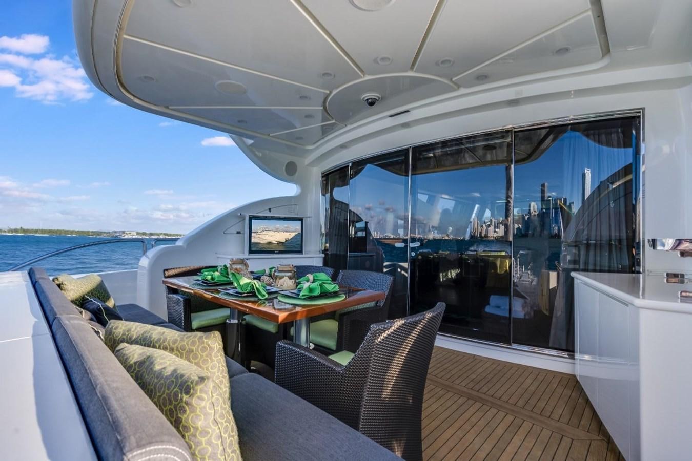 a boat with a table and chairs aboard LEOPARD Yacht for Sale