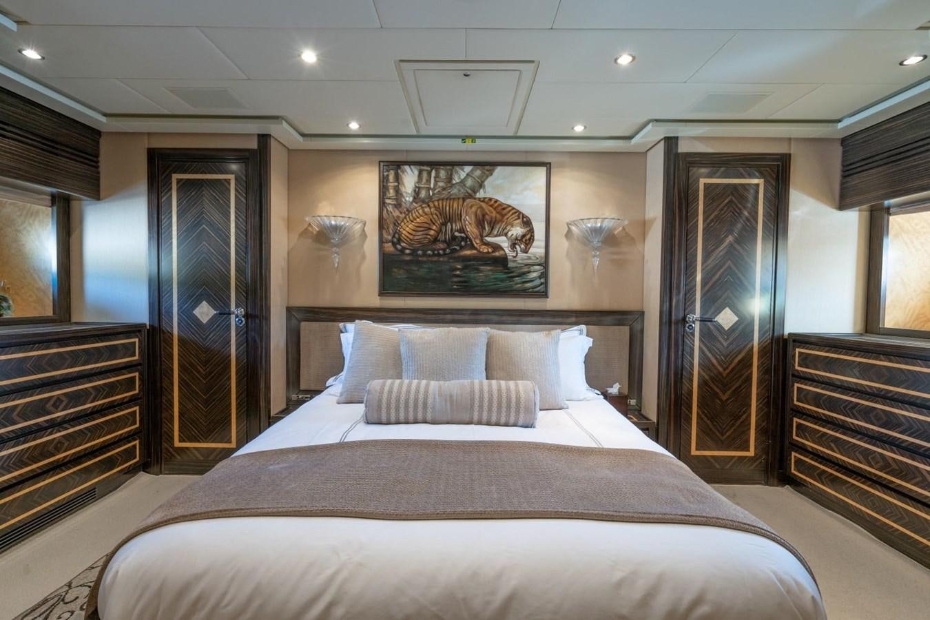a large bedroom with a large bed aboard LEOPARD Yacht for Sale