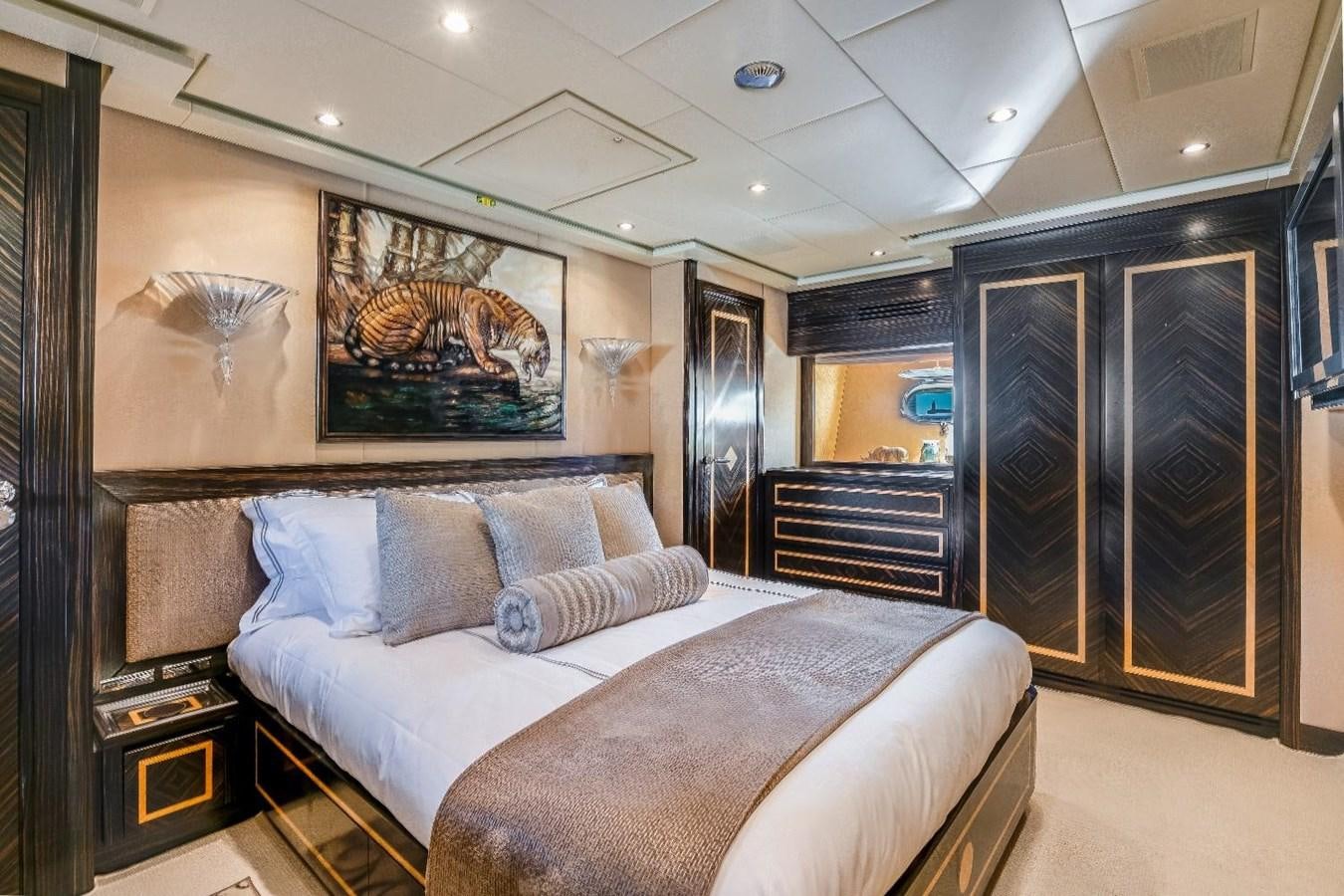 a large bedroom with a bed aboard LEOPARD Yacht for Sale