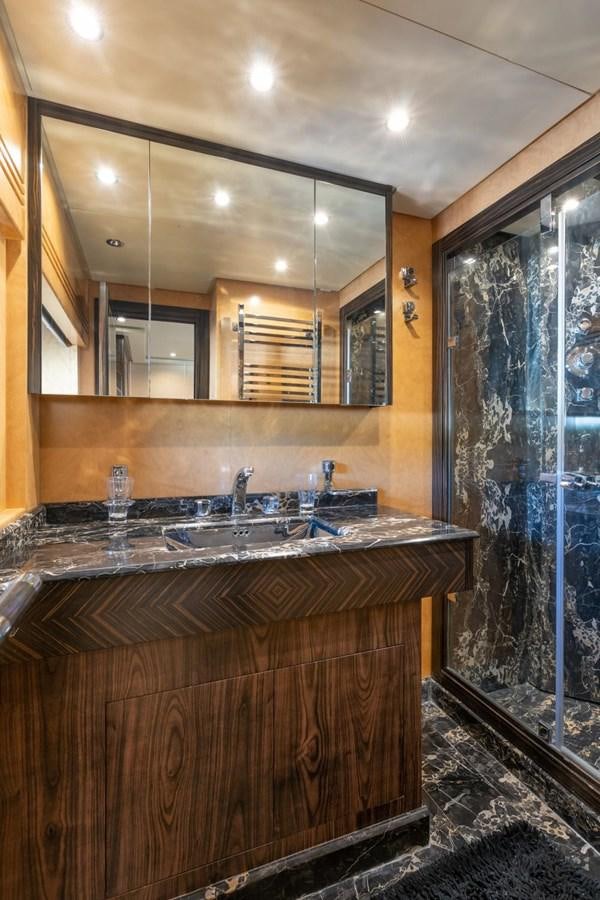 a bathroom with a sink and a mirror aboard LEOPARD Yacht for Sale