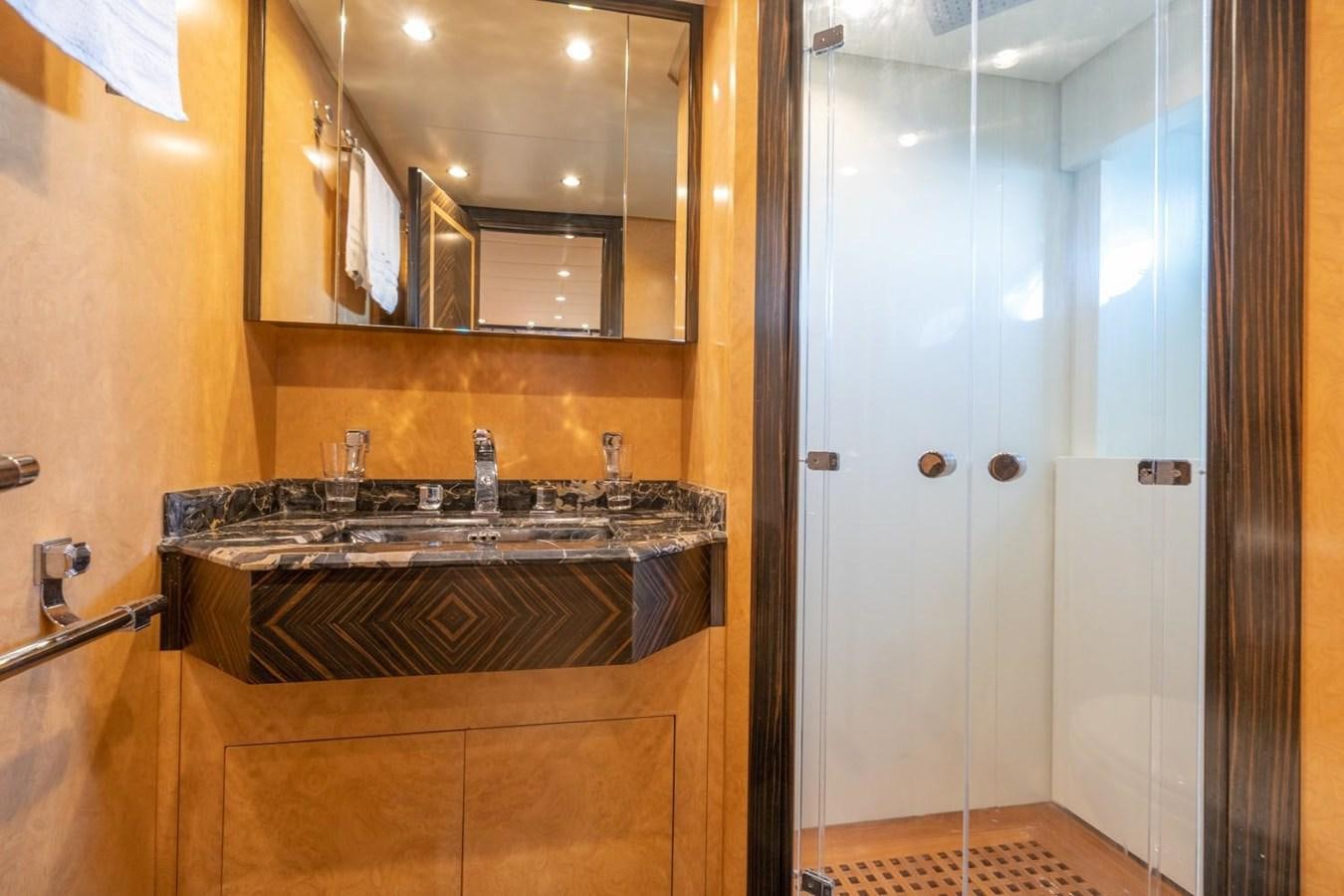 a bathroom with a sink and a mirror aboard LEOPARD Yacht for Sale