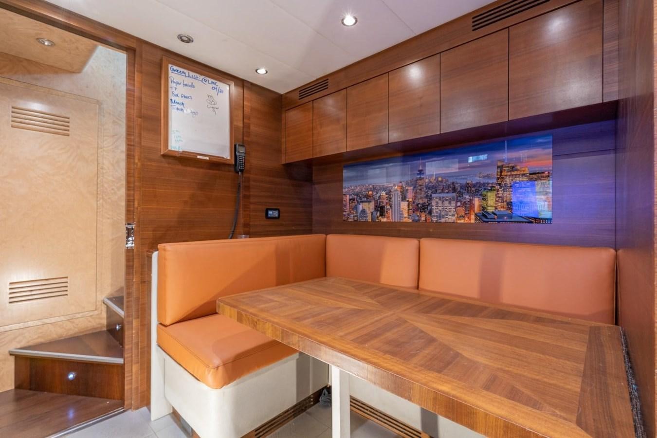 a room with a table and chairs aboard LEOPARD Yacht for Sale