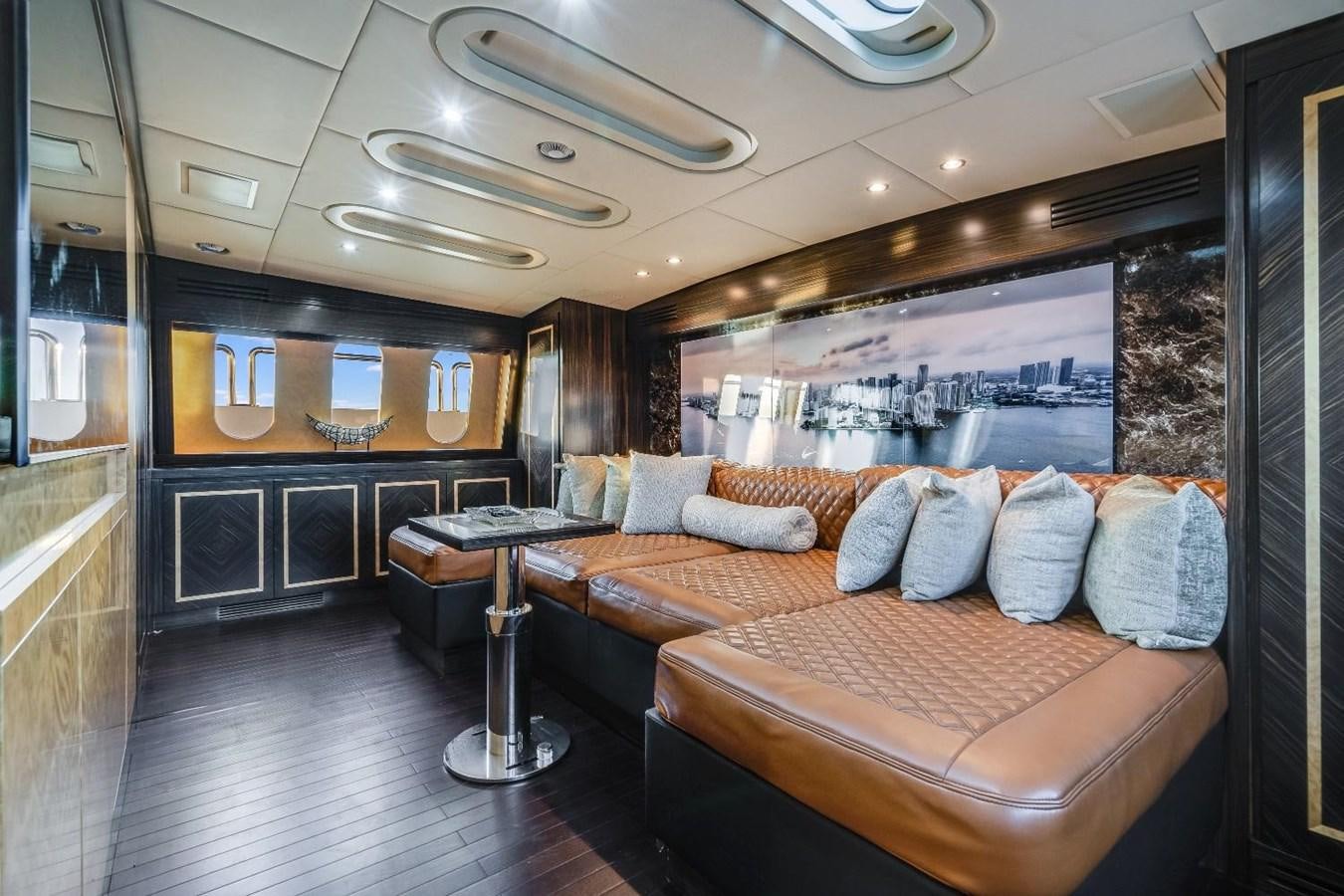 a living room with a couch and a table aboard LEOPARD Yacht for Sale