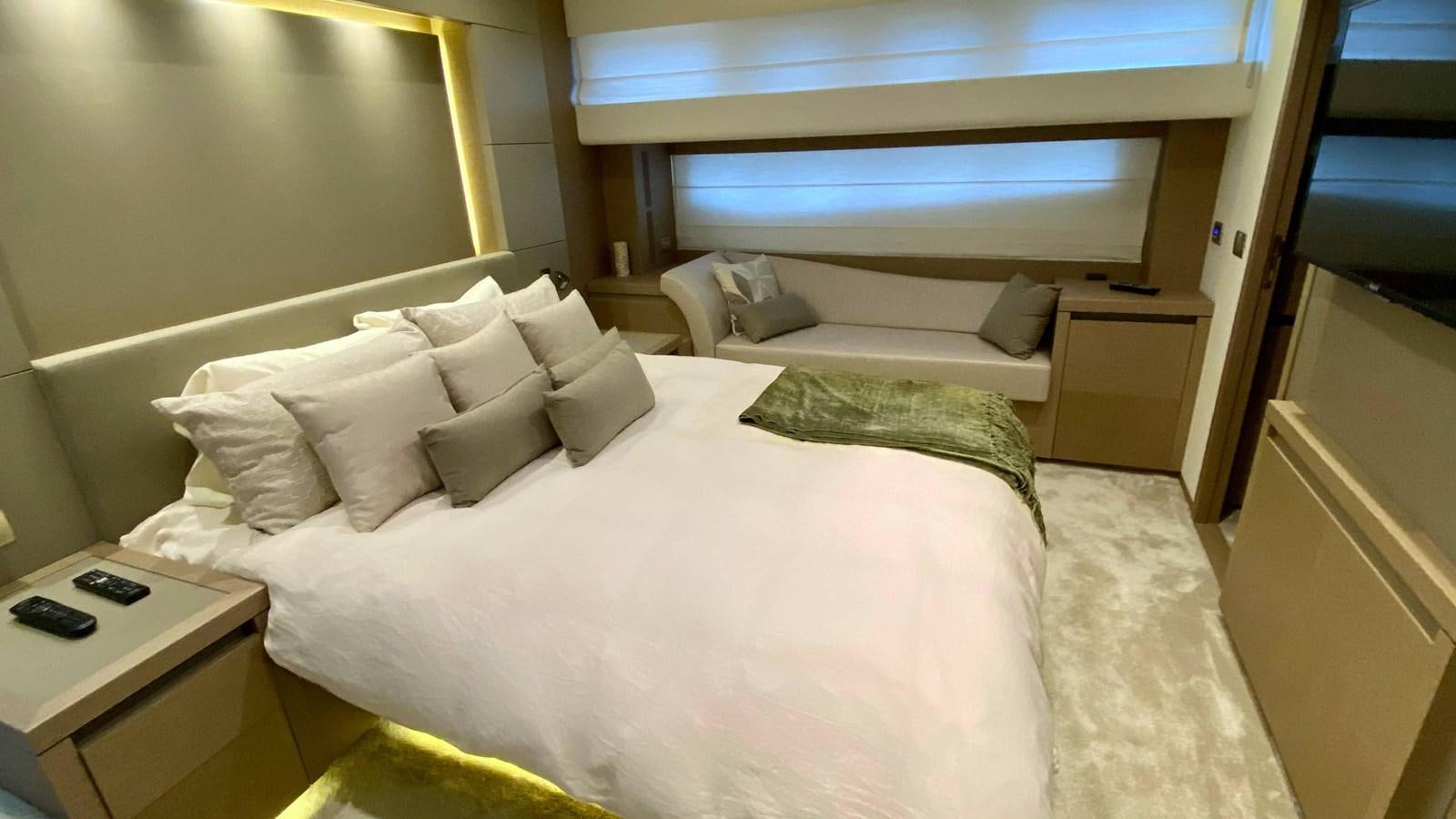 a bed with white sheets aboard 2016 PRESTIGE  750 Yacht for Sale