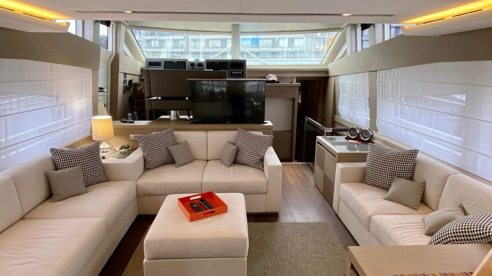 a living room with a couch and a tv aboard 2016 PRESTIGE  750 Yacht for Sale