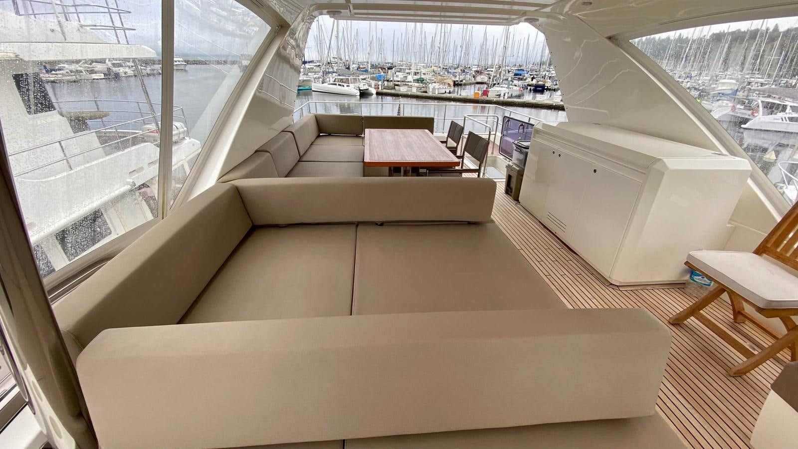 a room with a couch and a table aboard 2016 PRESTIGE  750 Yacht for Sale