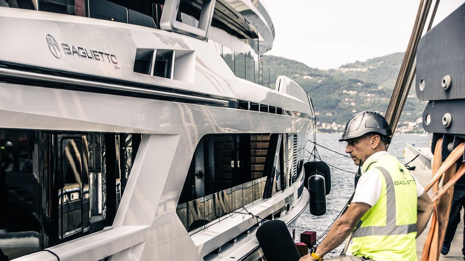 a man in a helmet on a boat aboard BAGLIETTO T52 HULL #04 Yacht for Sale