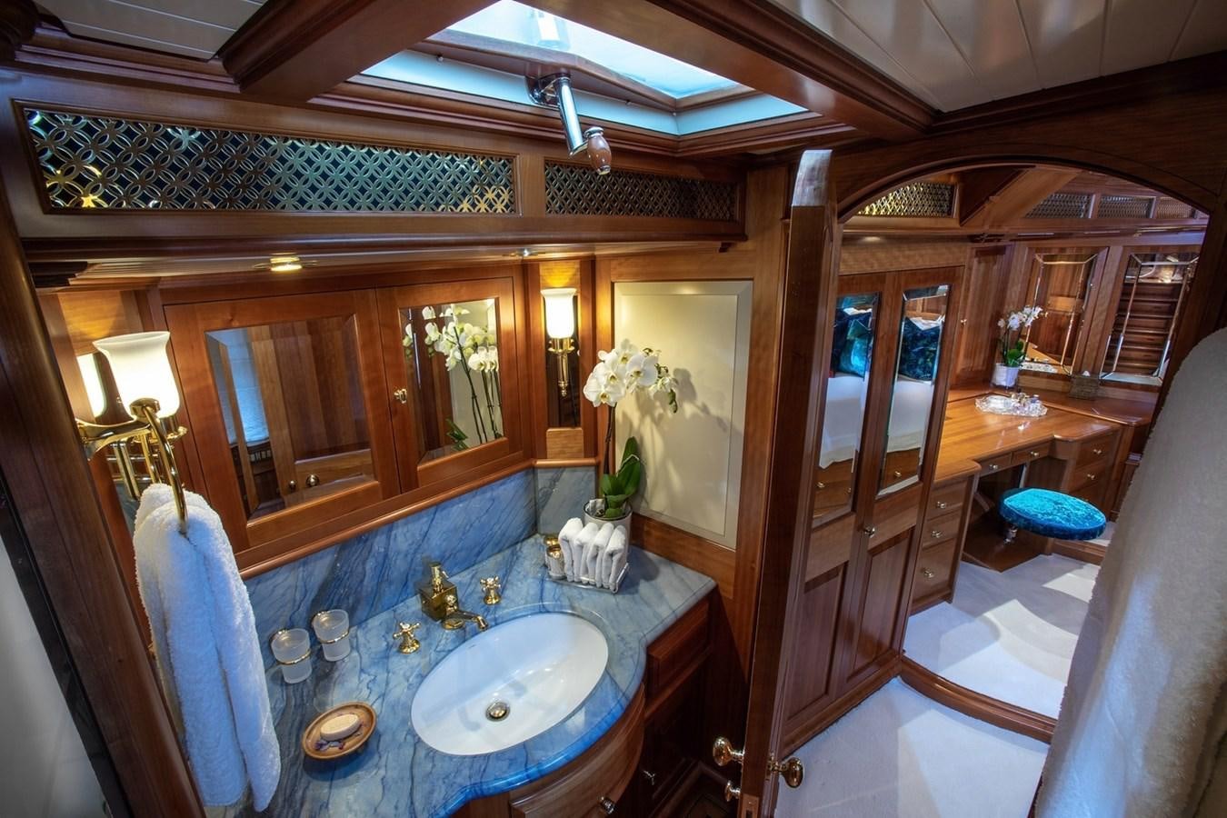 a bathroom with a large mirror aboard LETHANTIA Yacht for Sale