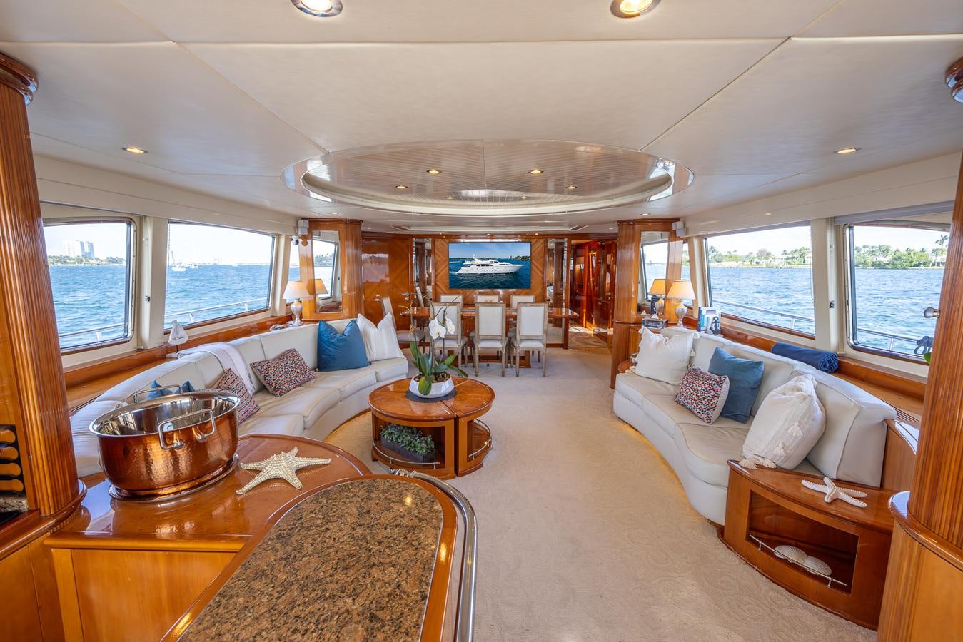 a living room with a large window aboard ENDLESS SUN Yacht for Sale