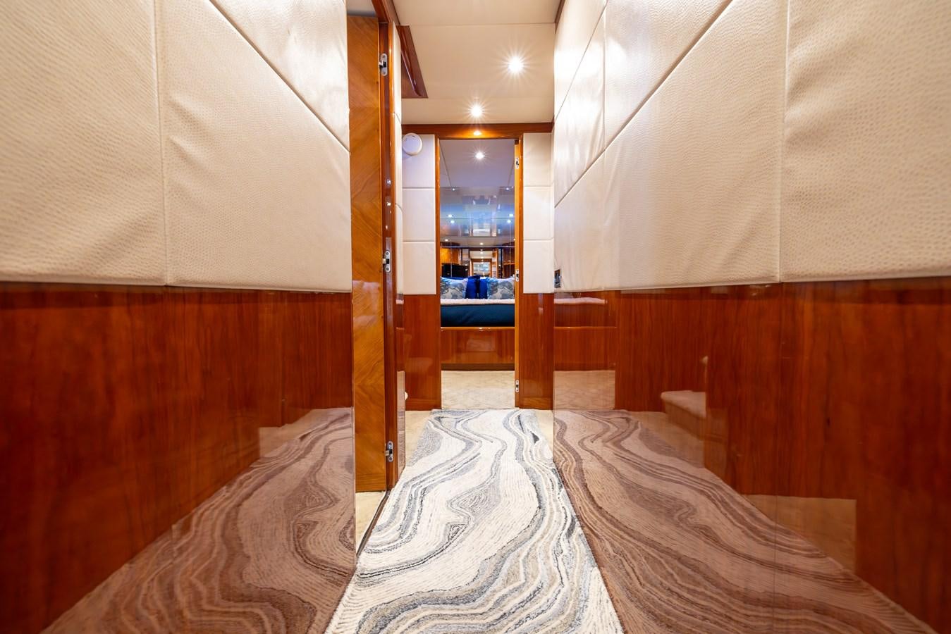 a room with a bed and a mirror aboard ENDLESS SUN Yacht for Sale