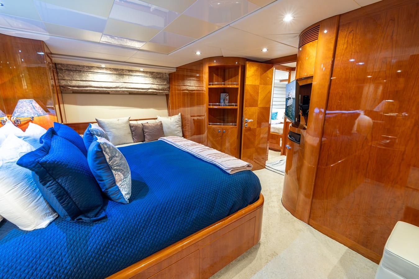 a room with a bed and a closet aboard ENDLESS SUN Yacht for Sale