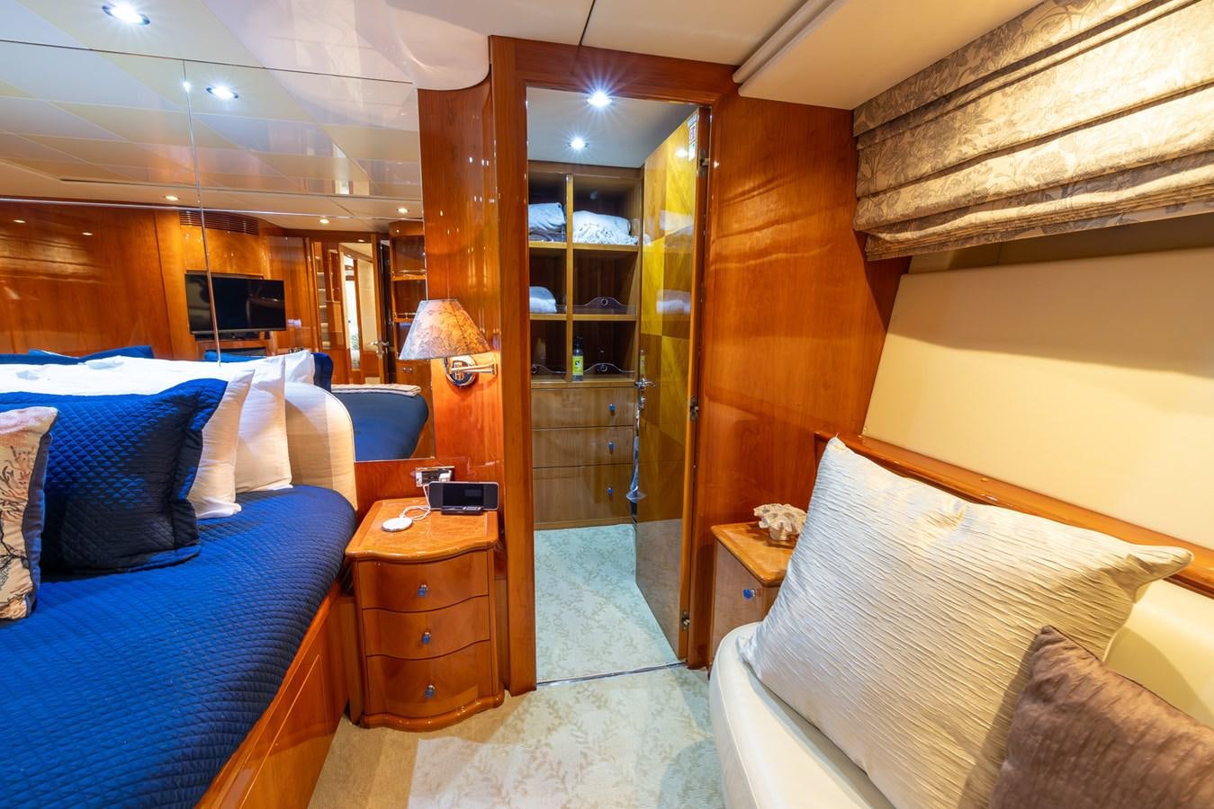 a room with a bed and a desk aboard ENDLESS SUN Yacht for Sale