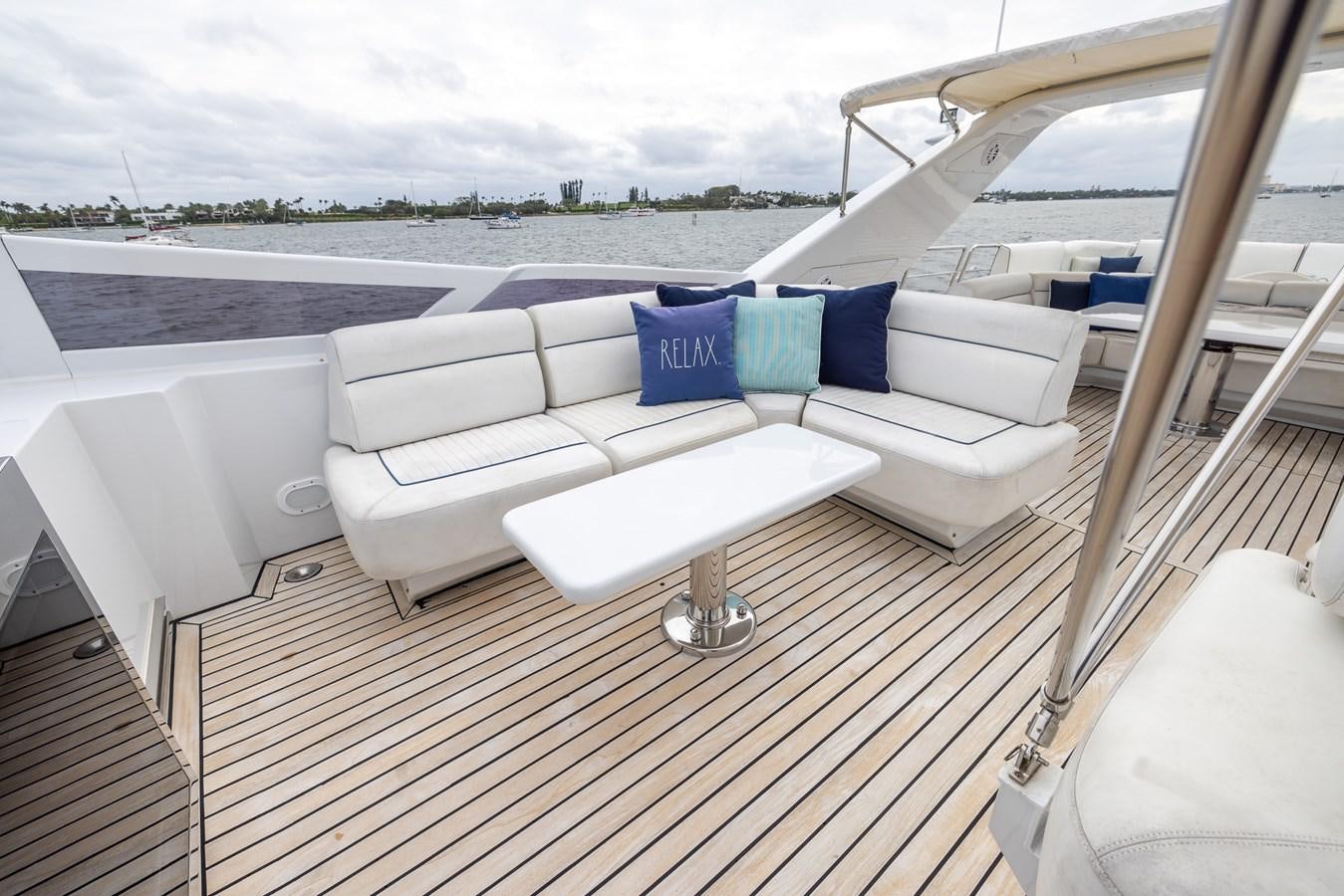 a white couch on a deck aboard ENDLESS SUN Yacht for Sale