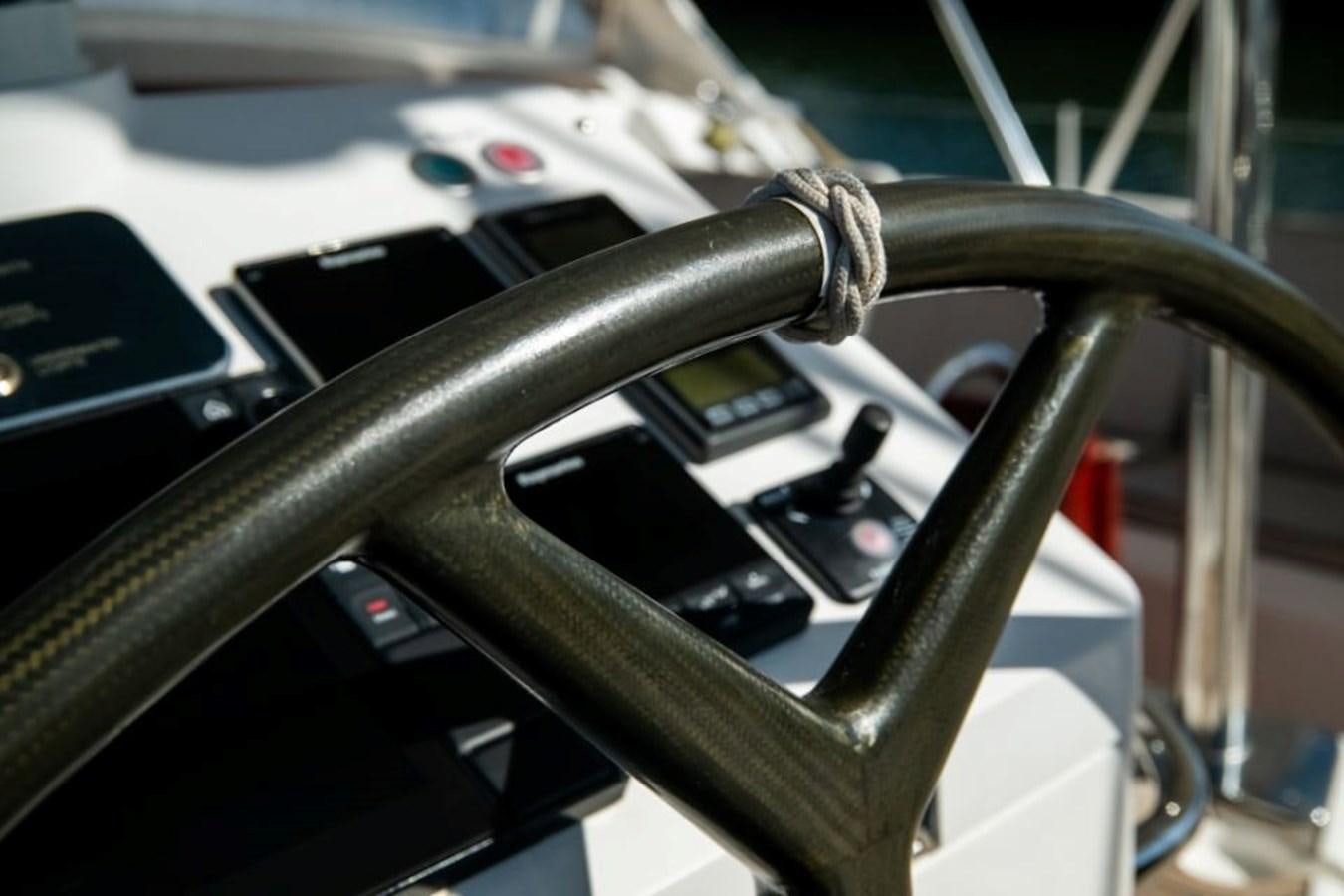 a car interior with a steering wheel aboard SAPPHIRE II OF LONDON Yacht for Sale