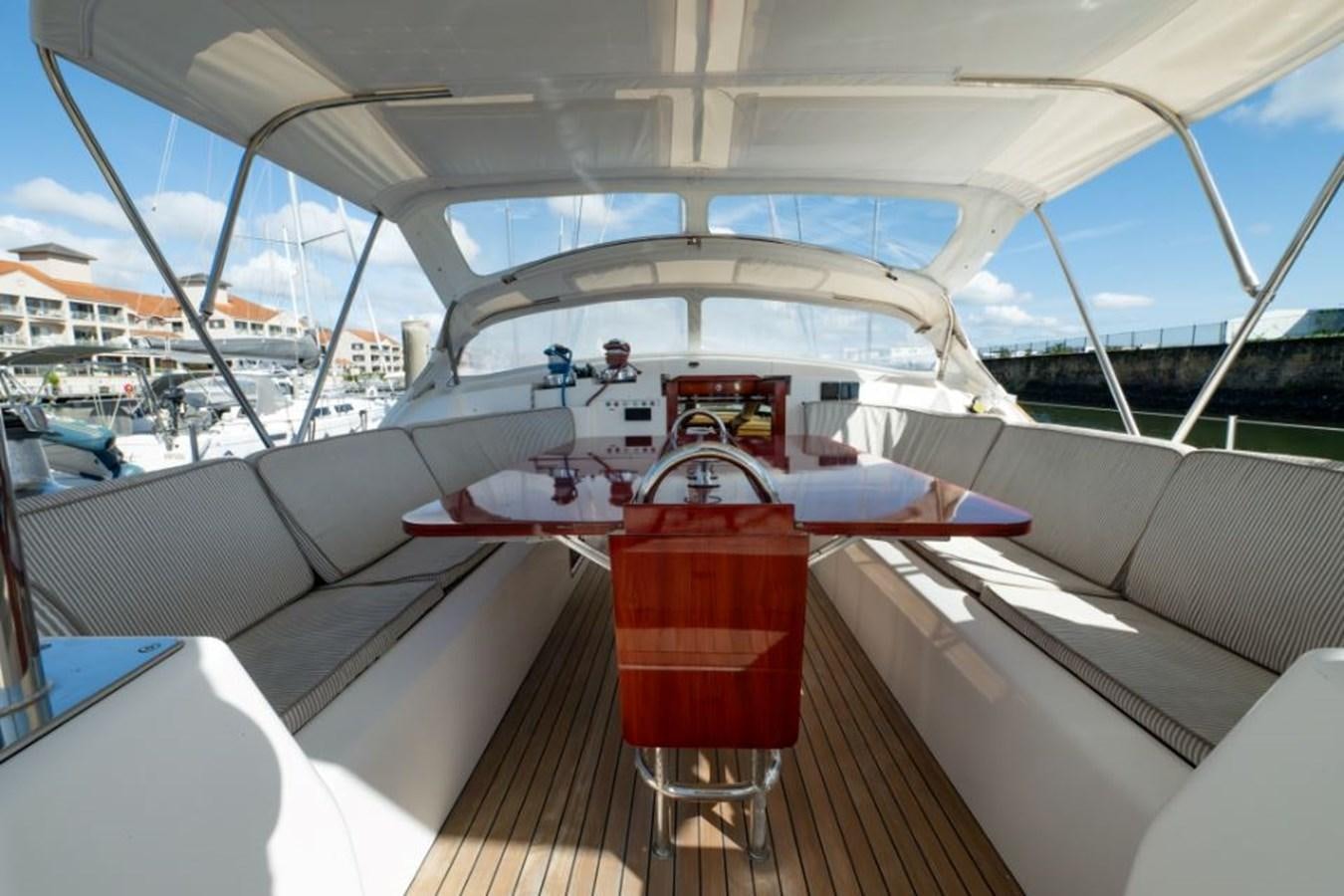 a boat with a surfboard on the deck aboard SAPPHIRE II OF LONDON Yacht for Sale