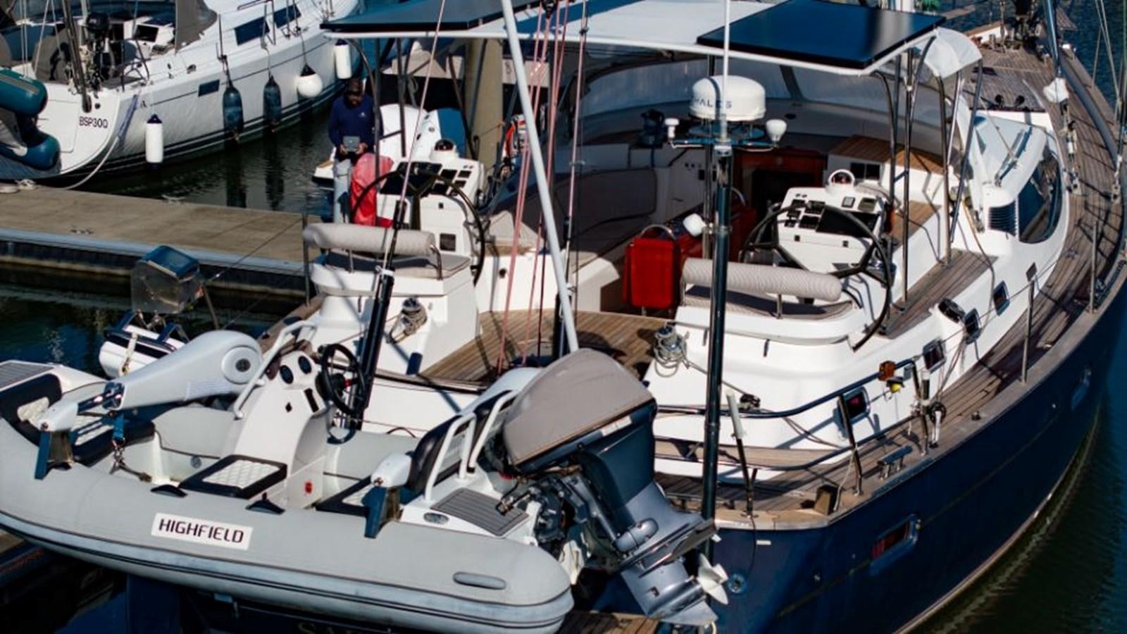 a boat docked at a pier aboard SAPPHIRE II OF LONDON Yacht for Sale