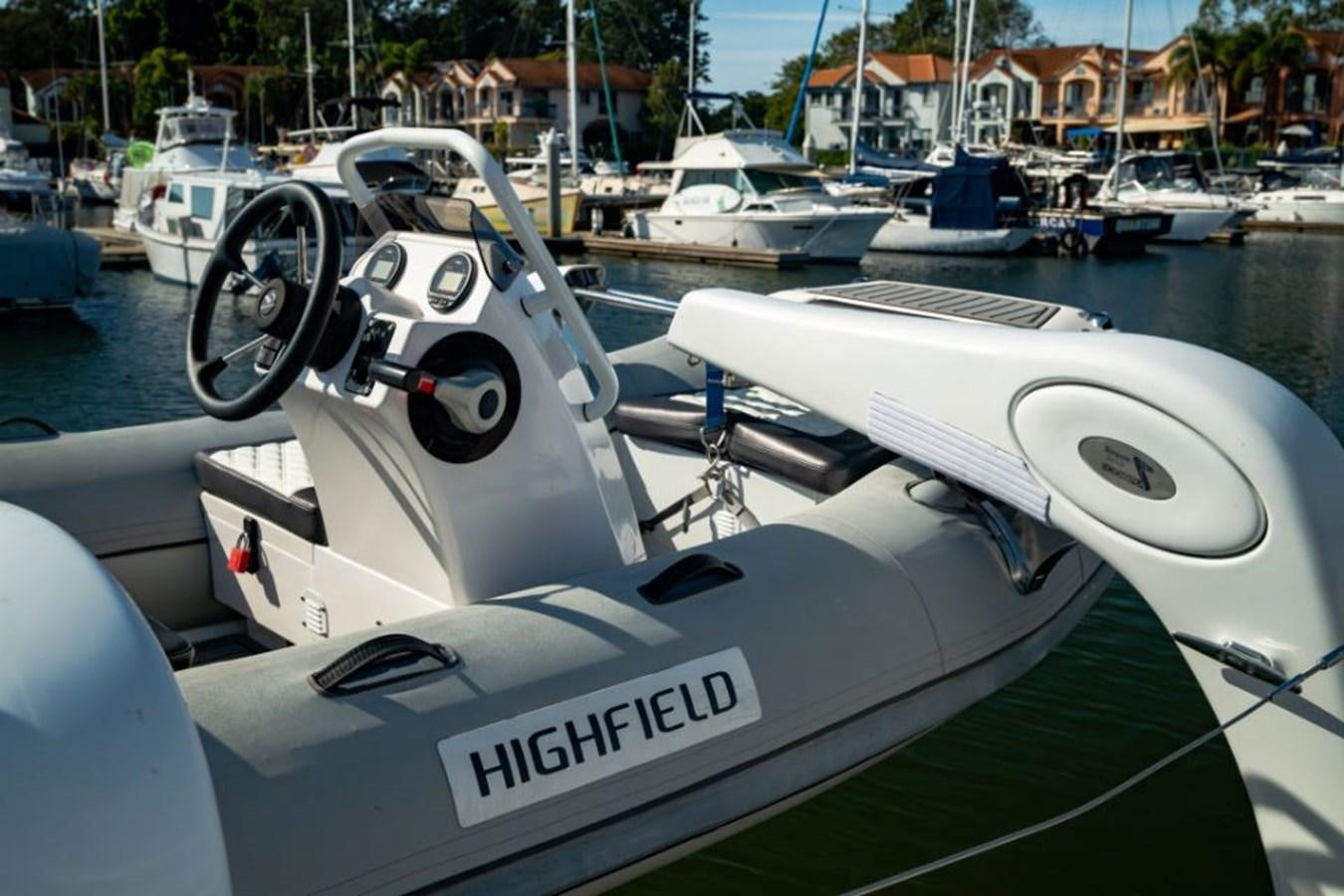 a white boat with a steering wheel aboard SAPPHIRE II OF LONDON Yacht for Sale