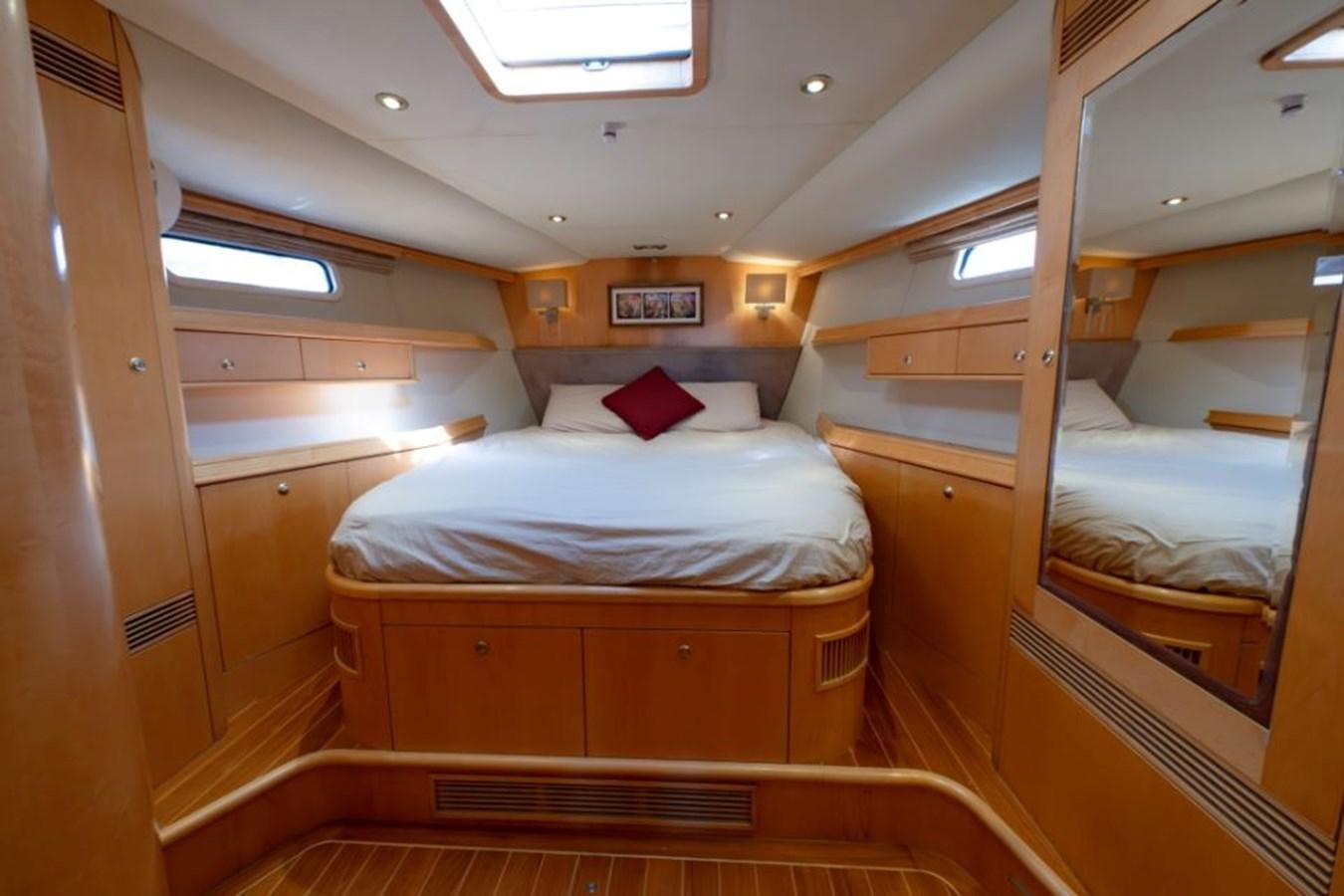 a cabin with a bed aboard SAPPHIRE II OF LONDON Yacht for Sale
