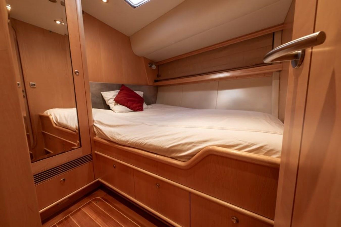 a bed in a room aboard SAPPHIRE II OF LONDON Yacht for Sale