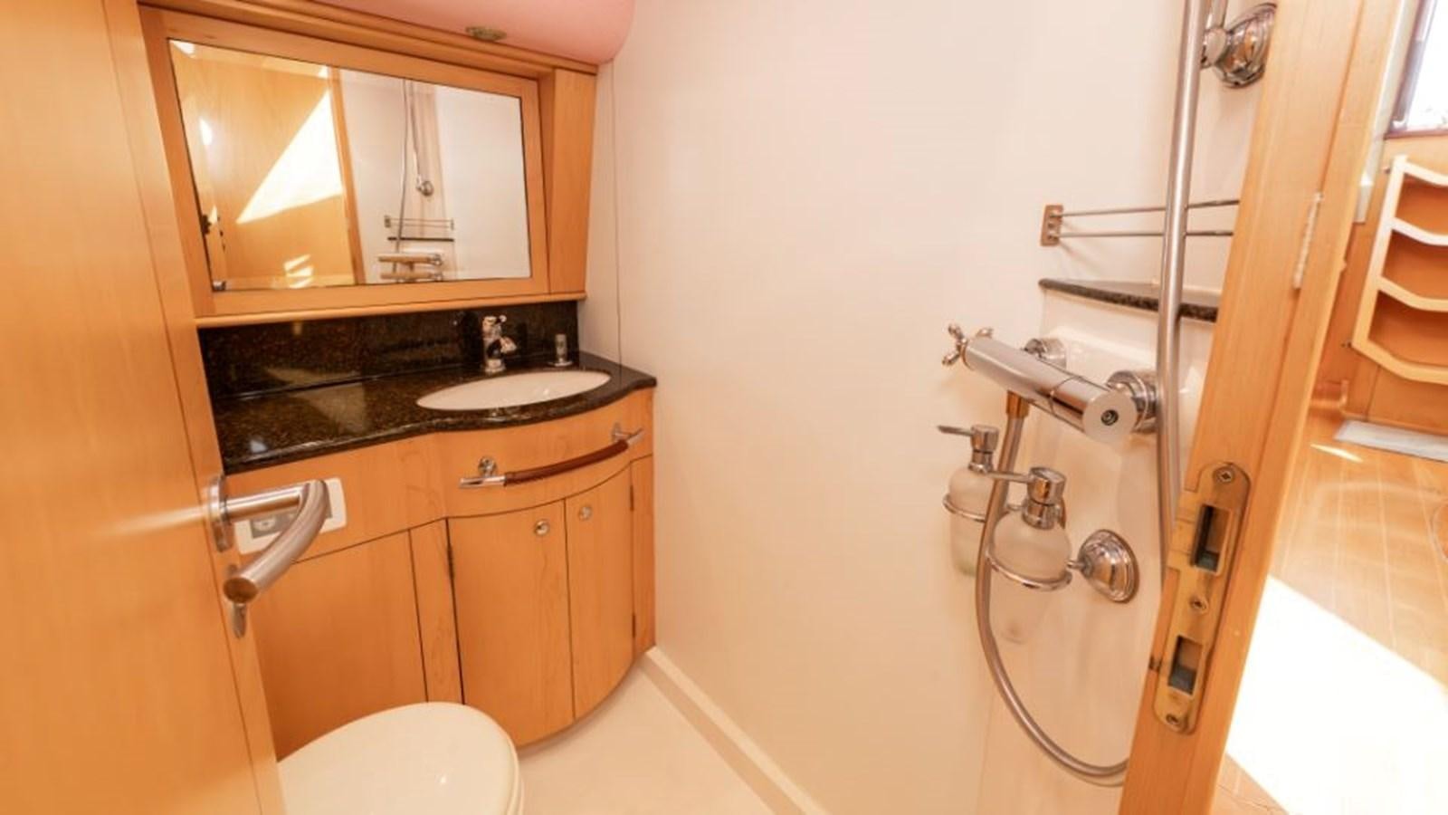 a bathroom with a sink and a toilet aboard SAPPHIRE II OF LONDON Yacht for Sale