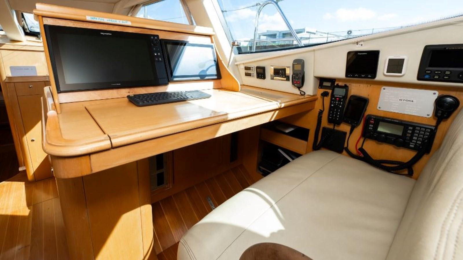 a room with a desk and a bed aboard SAPPHIRE II OF LONDON Yacht for Sale