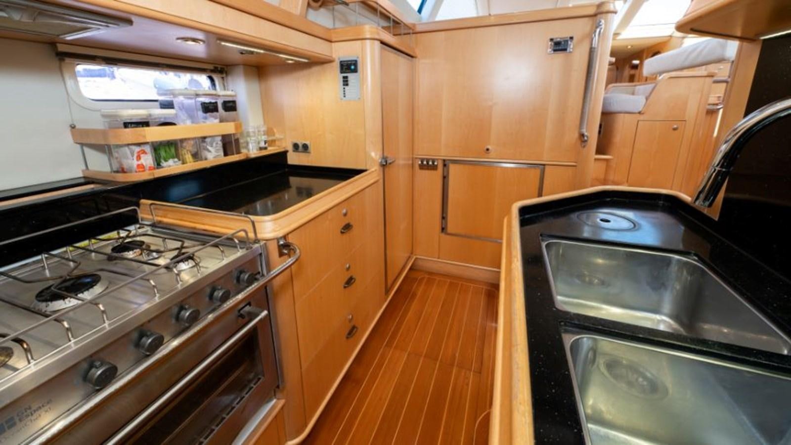 a kitchen with stainless steel appliances aboard SAPPHIRE II OF LONDON Yacht for Sale