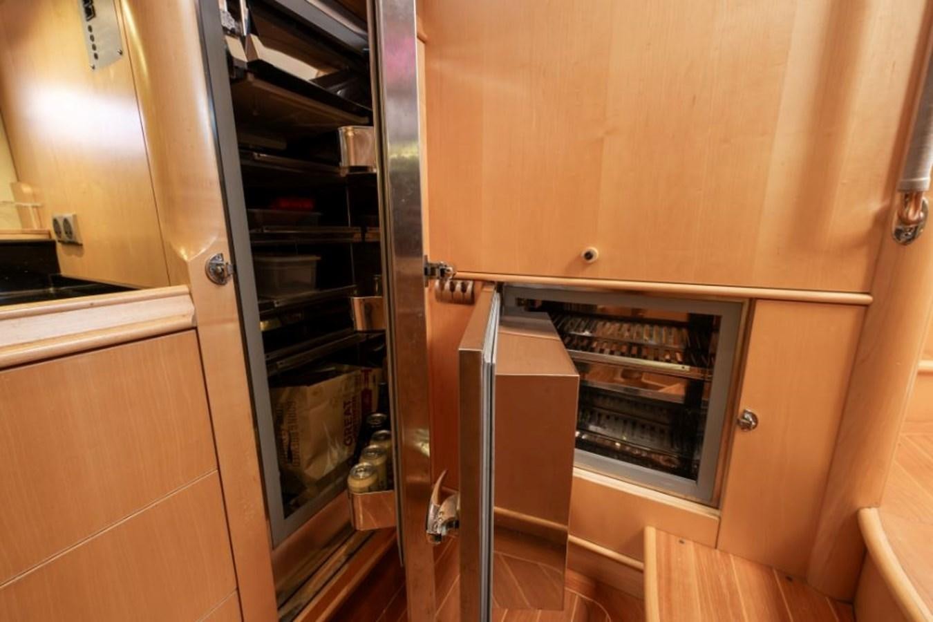 a kitchen with a stainless steel oven aboard SAPPHIRE II OF LONDON Yacht for Sale