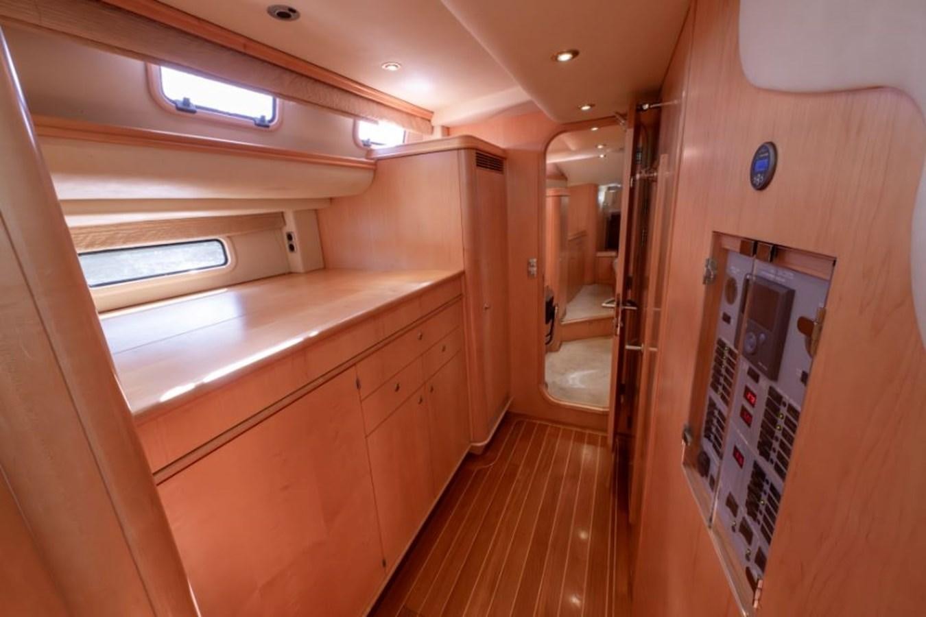 a room with a wood floor and cabinets and a door with a window aboard SAPPHIRE II OF LONDON Yacht for Sale