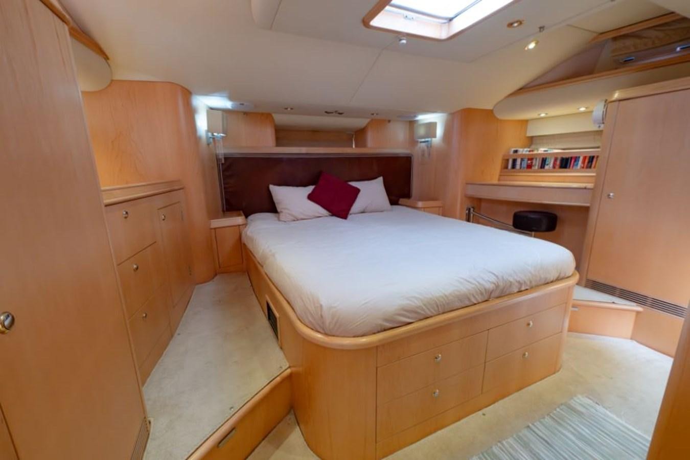 a room with a bed and a desk aboard SAPPHIRE II OF LONDON Yacht for Sale