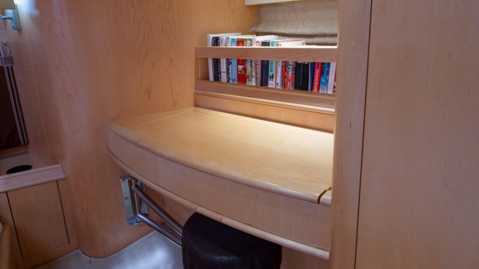 a wooden shelf with a bookcase aboard SAPPHIRE II OF LONDON Yacht for Sale