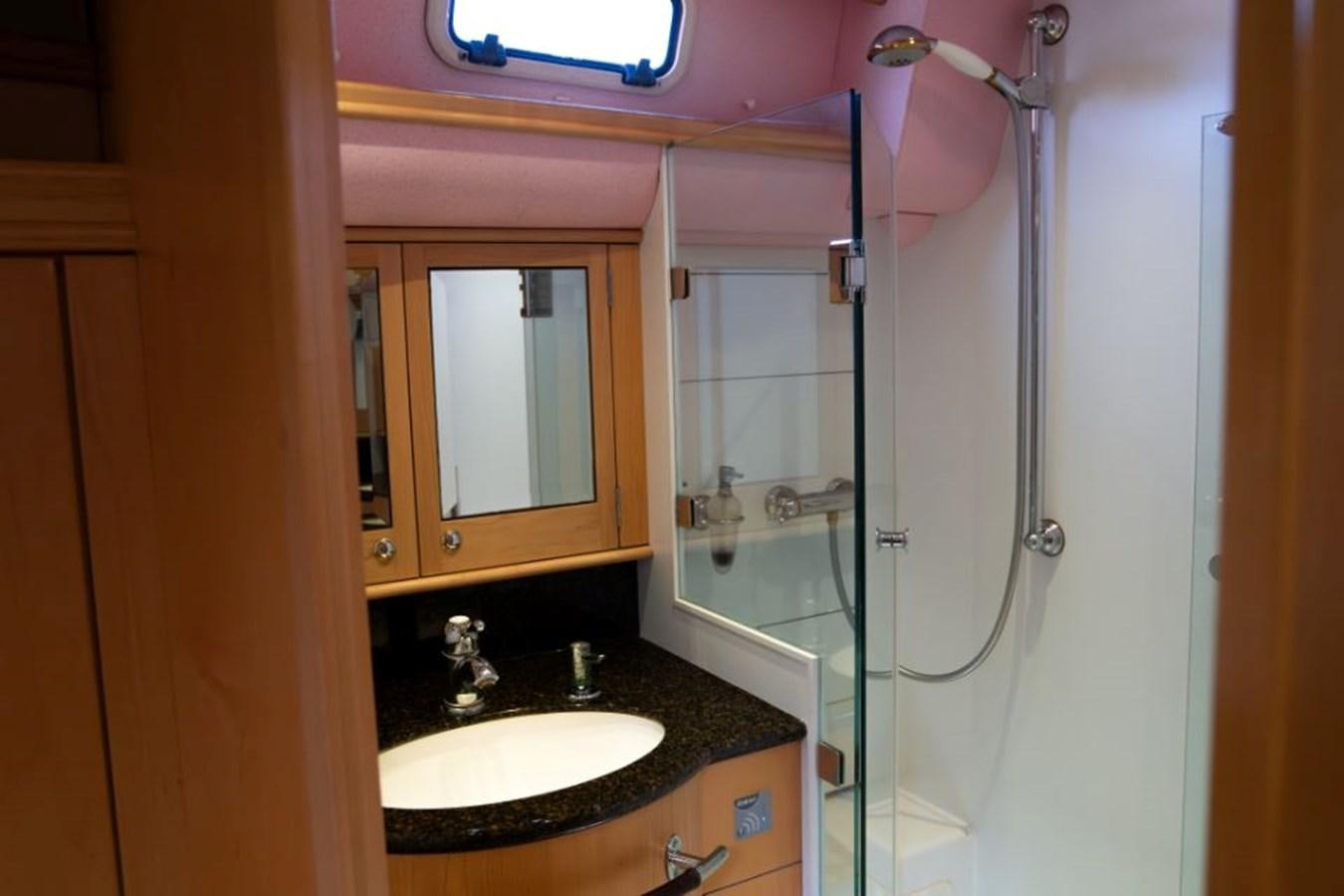 a bathroom with a sink and a shower aboard SAPPHIRE II OF LONDON Yacht for Sale