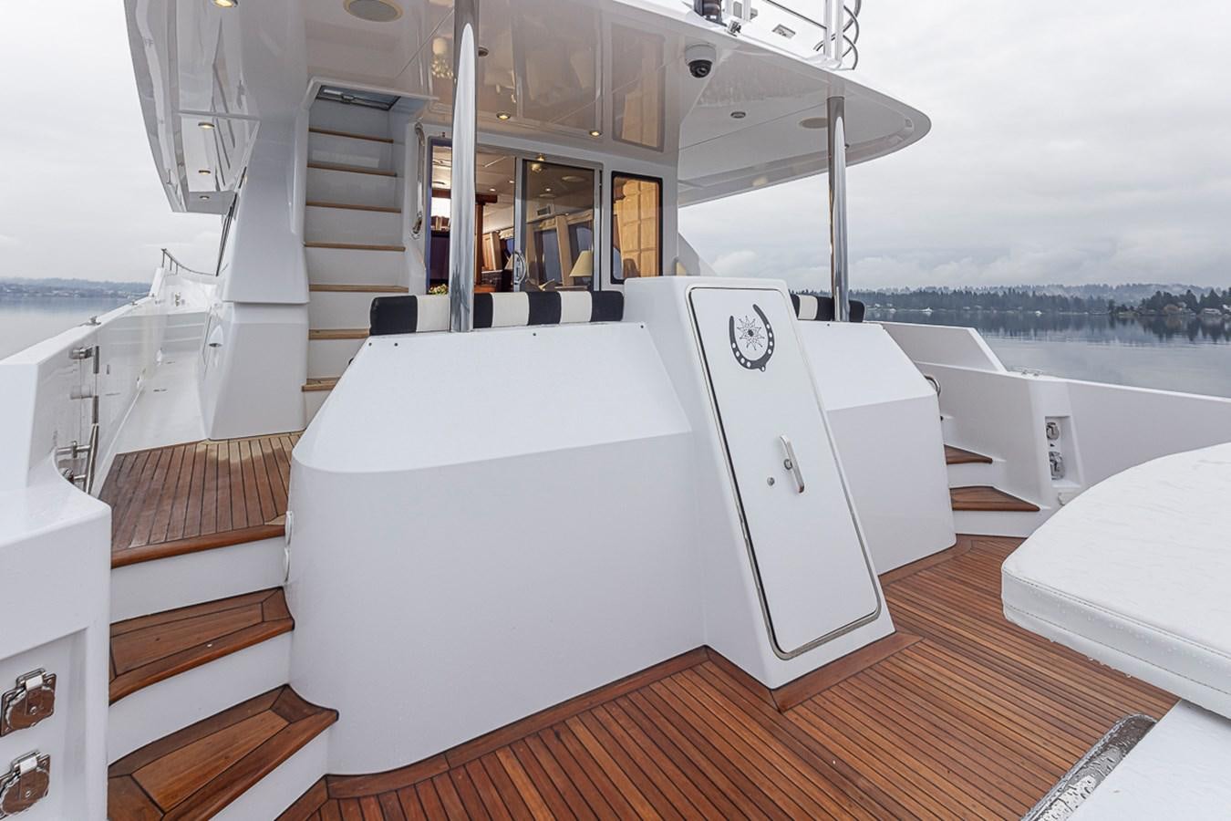 a white kitchen with a large white refrigerator aboard SEA SPUR Yacht for Sale