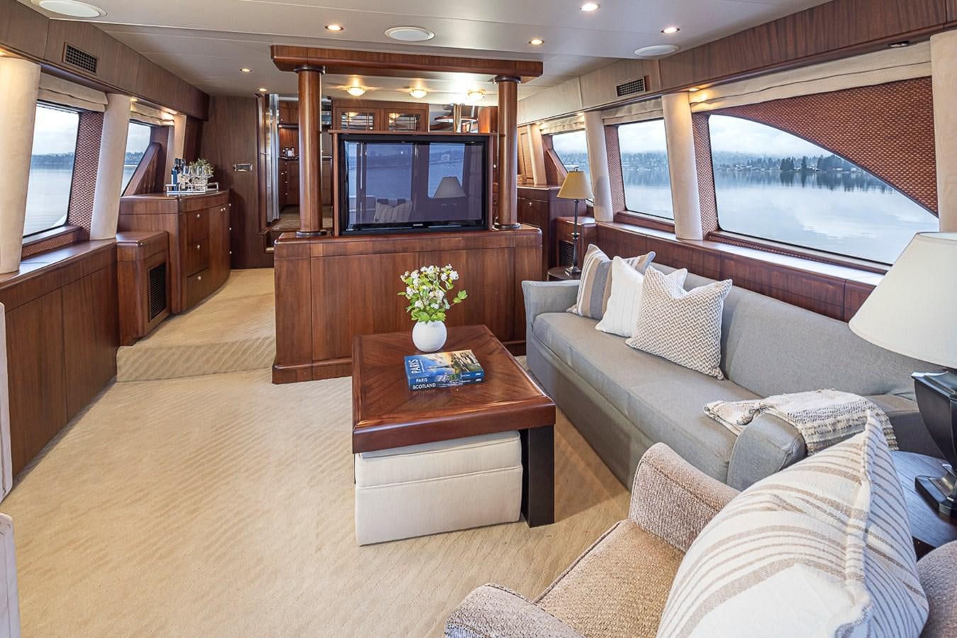 a living room with a large television aboard SEA SPUR Yacht for Sale
