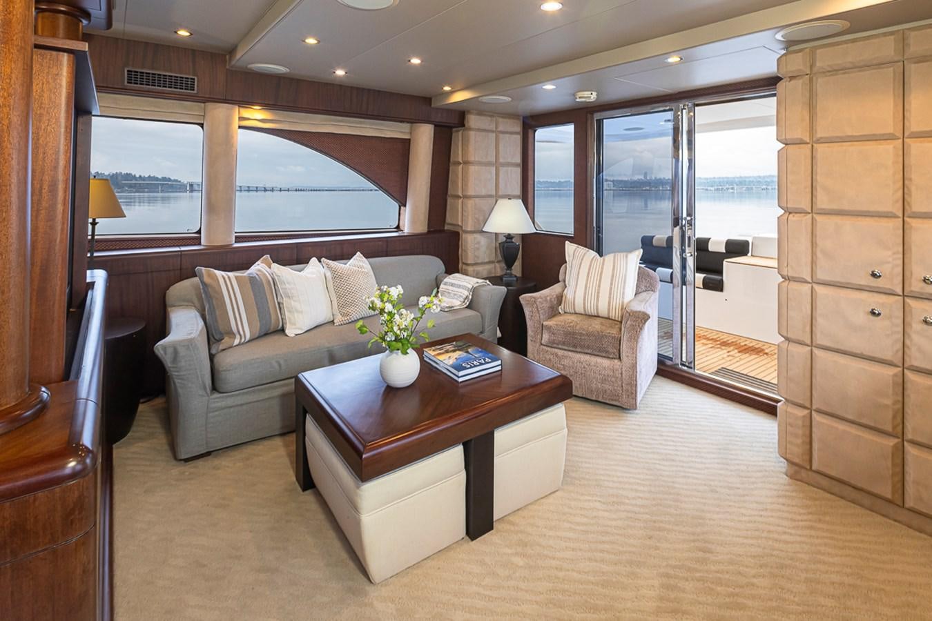 a living room with a couch and a coffee table aboard SEA SPUR Yacht for Sale