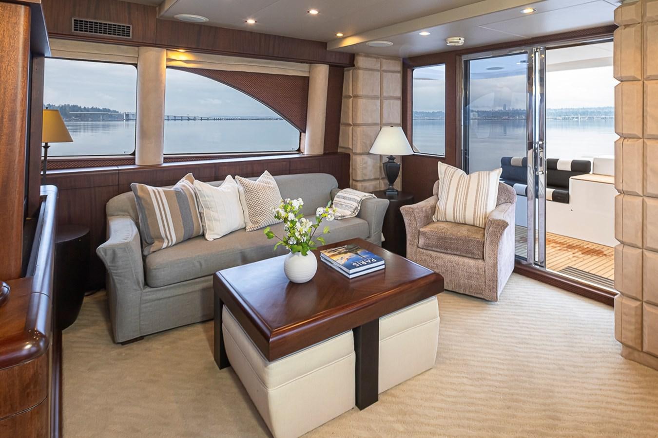 a living room with a couch and a coffee table aboard SEA SPUR Yacht for Sale