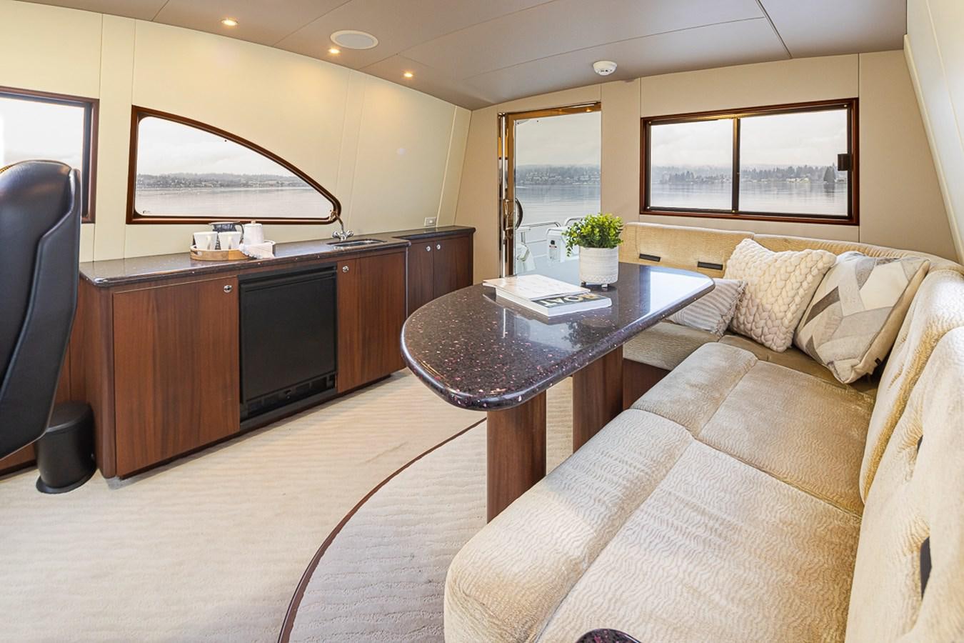 a living room with a couch and a coffee table aboard SEA SPUR Yacht for Sale