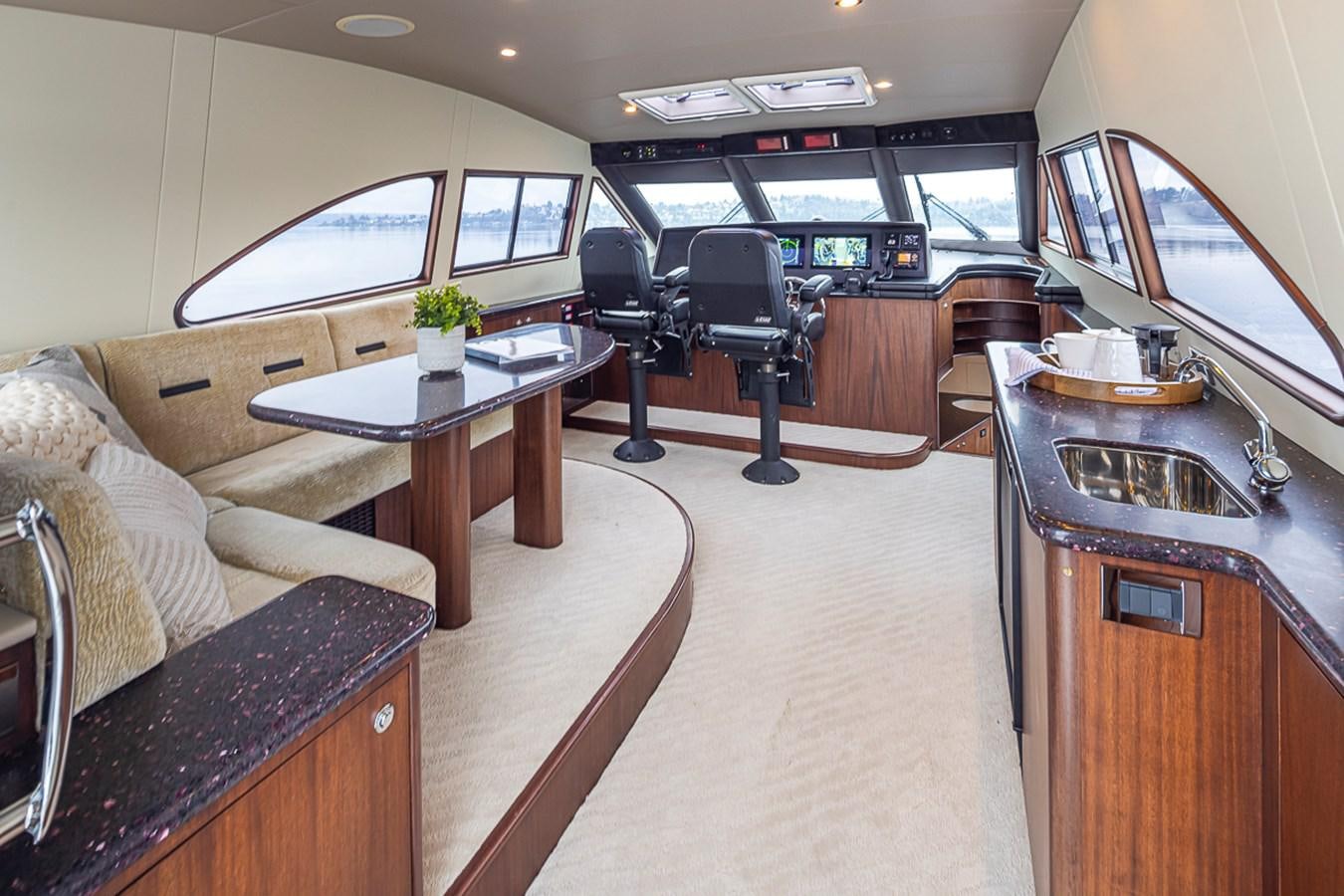 a living room with a couch and a coffee table aboard SEA SPUR Yacht for Sale