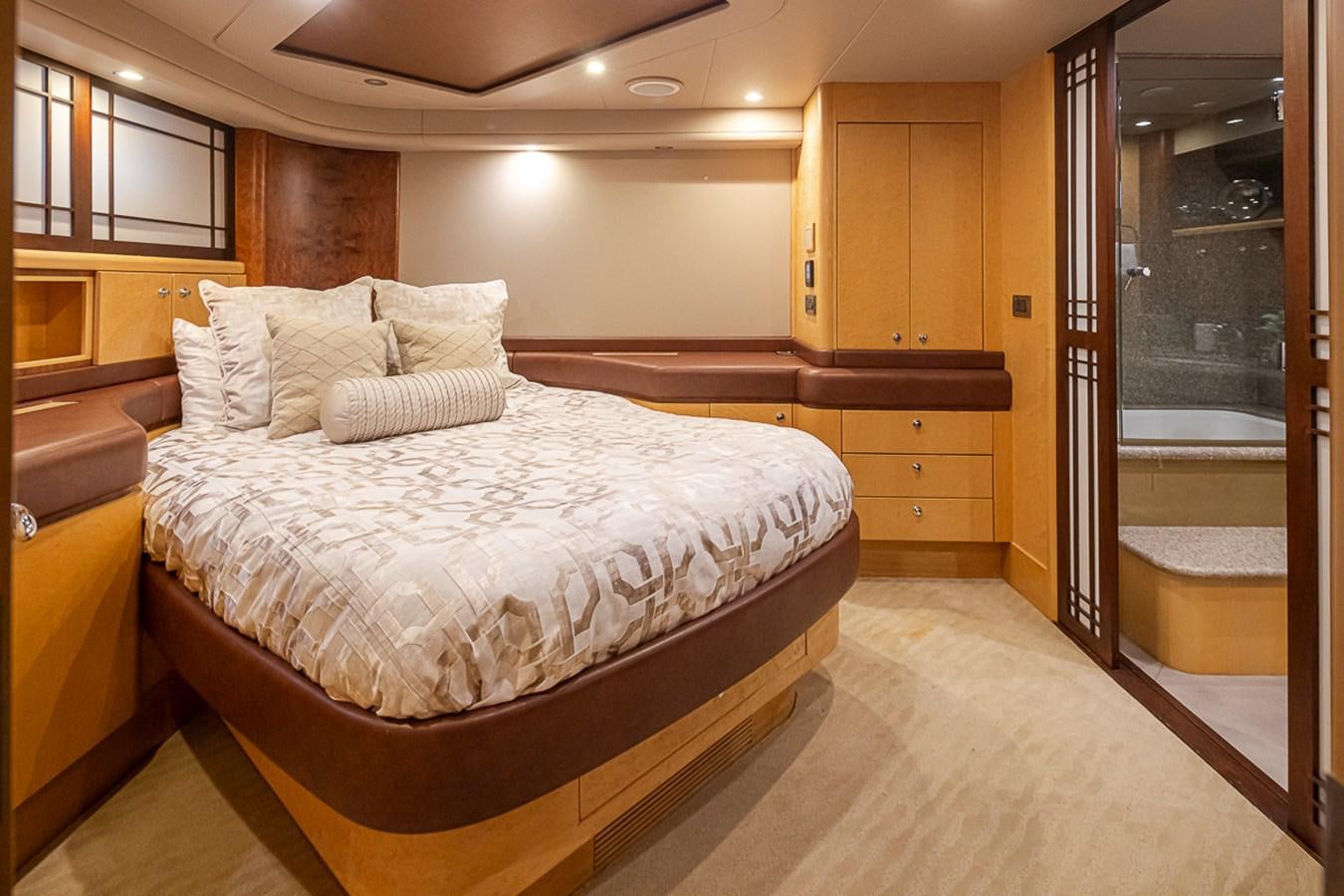 a bedroom with a bed and a closet aboard SEA SPUR Yacht for Sale