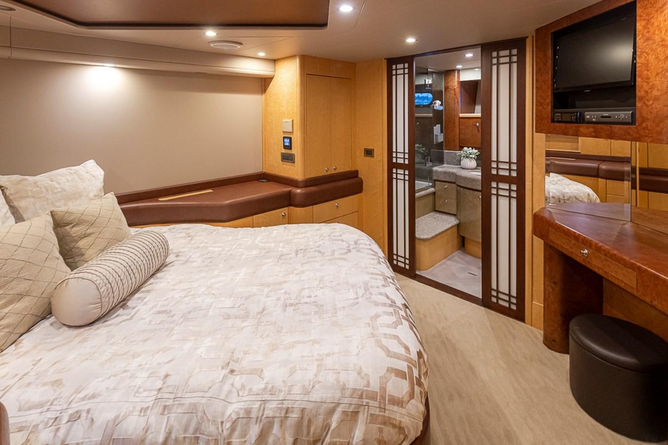 a hotel room with a bed and tv aboard SEA SPUR Yacht for Sale