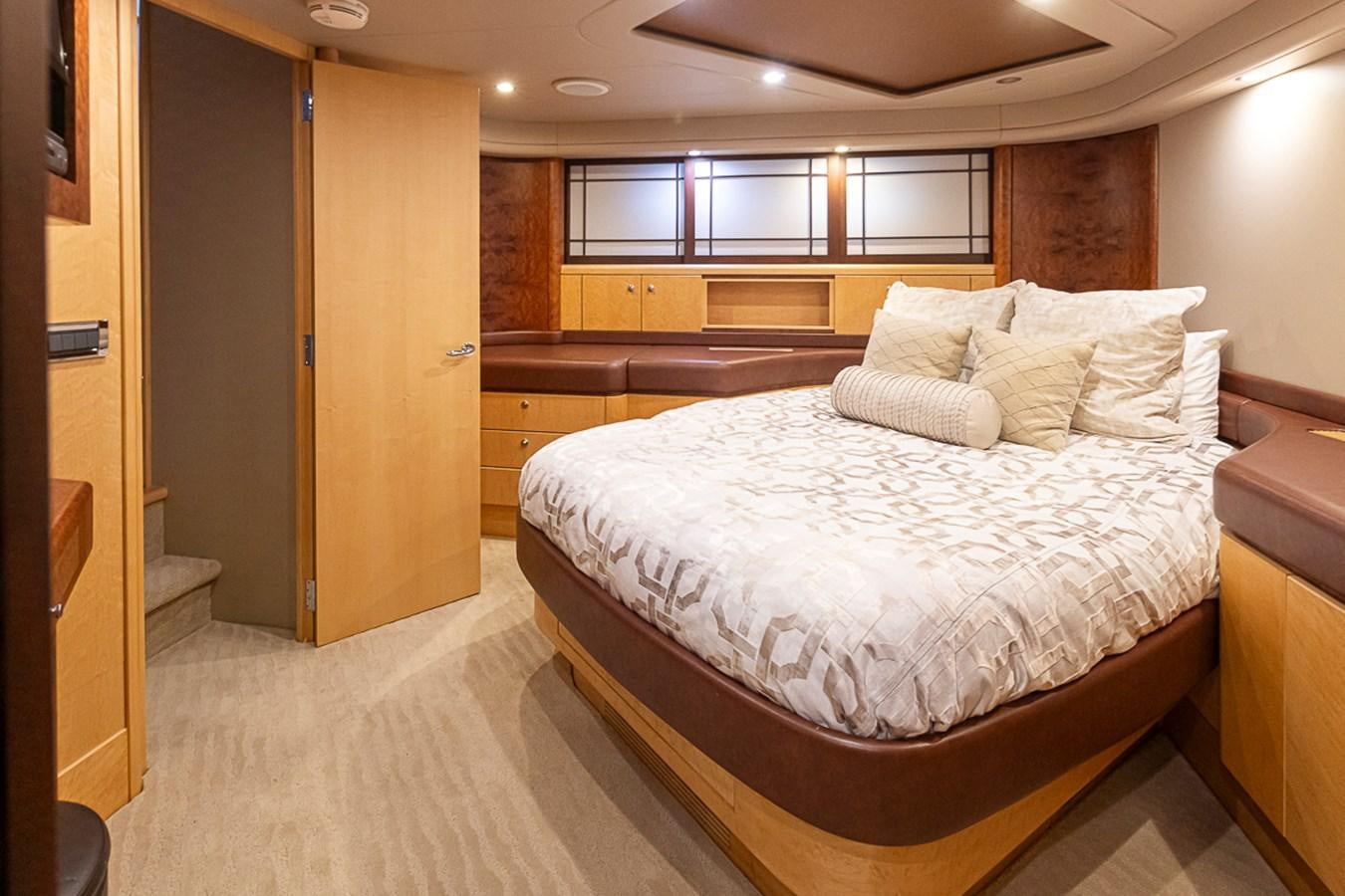 a room with a bed and a closet aboard SEA SPUR Yacht for Sale