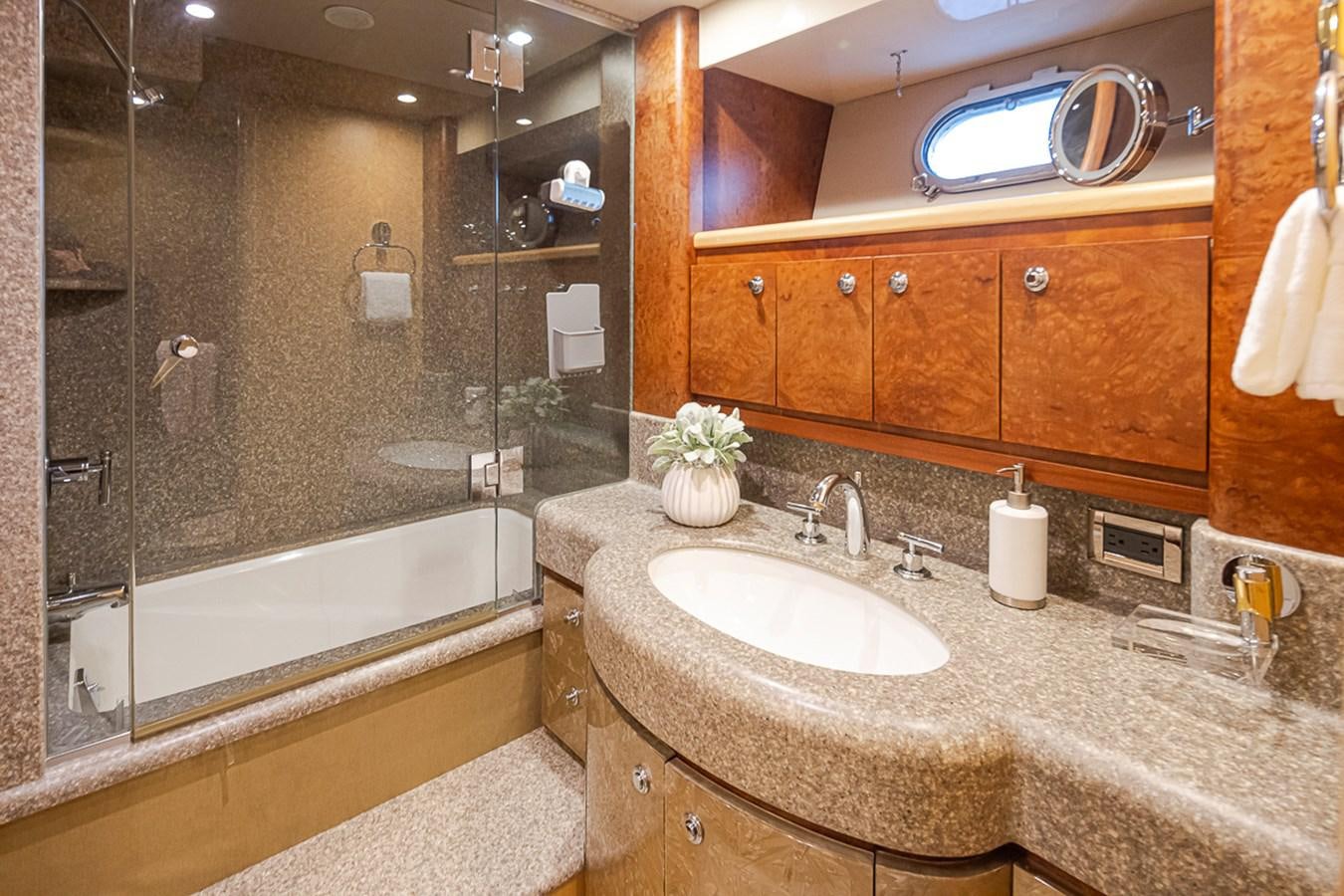 a bathroom with a marble countertop aboard SEA SPUR Yacht for Sale