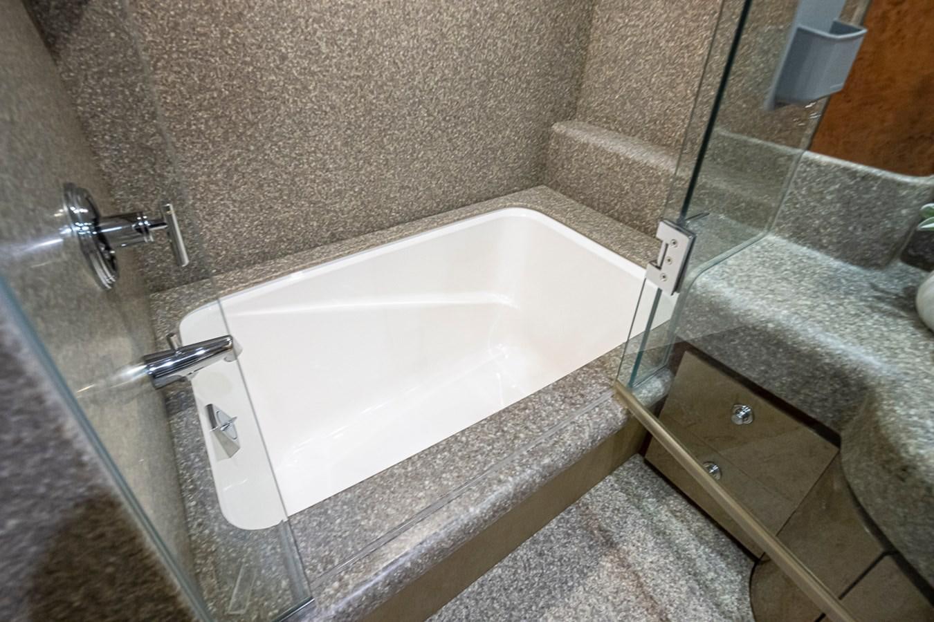 a bathtub in a bathroom aboard SEA SPUR Yacht for Sale