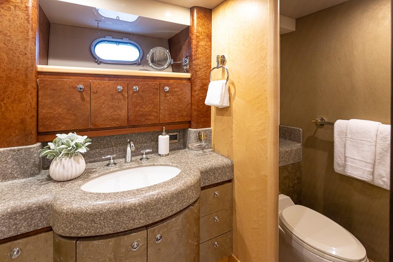 a bathroom with a sink and toilet aboard SEA SPUR Yacht for Sale