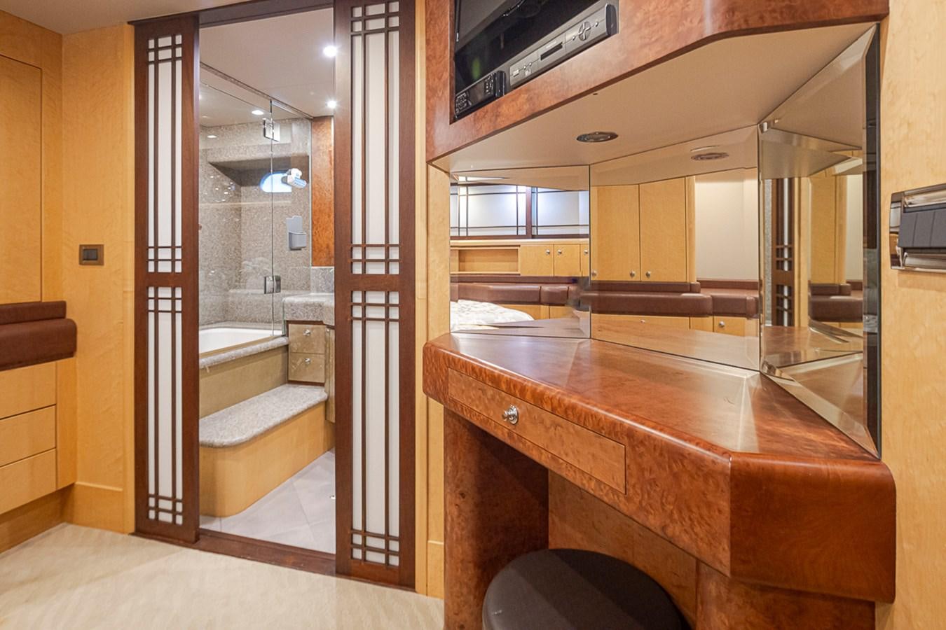 a bathroom with a countertop sink and a mirror aboard SEA SPUR Yacht for Sale