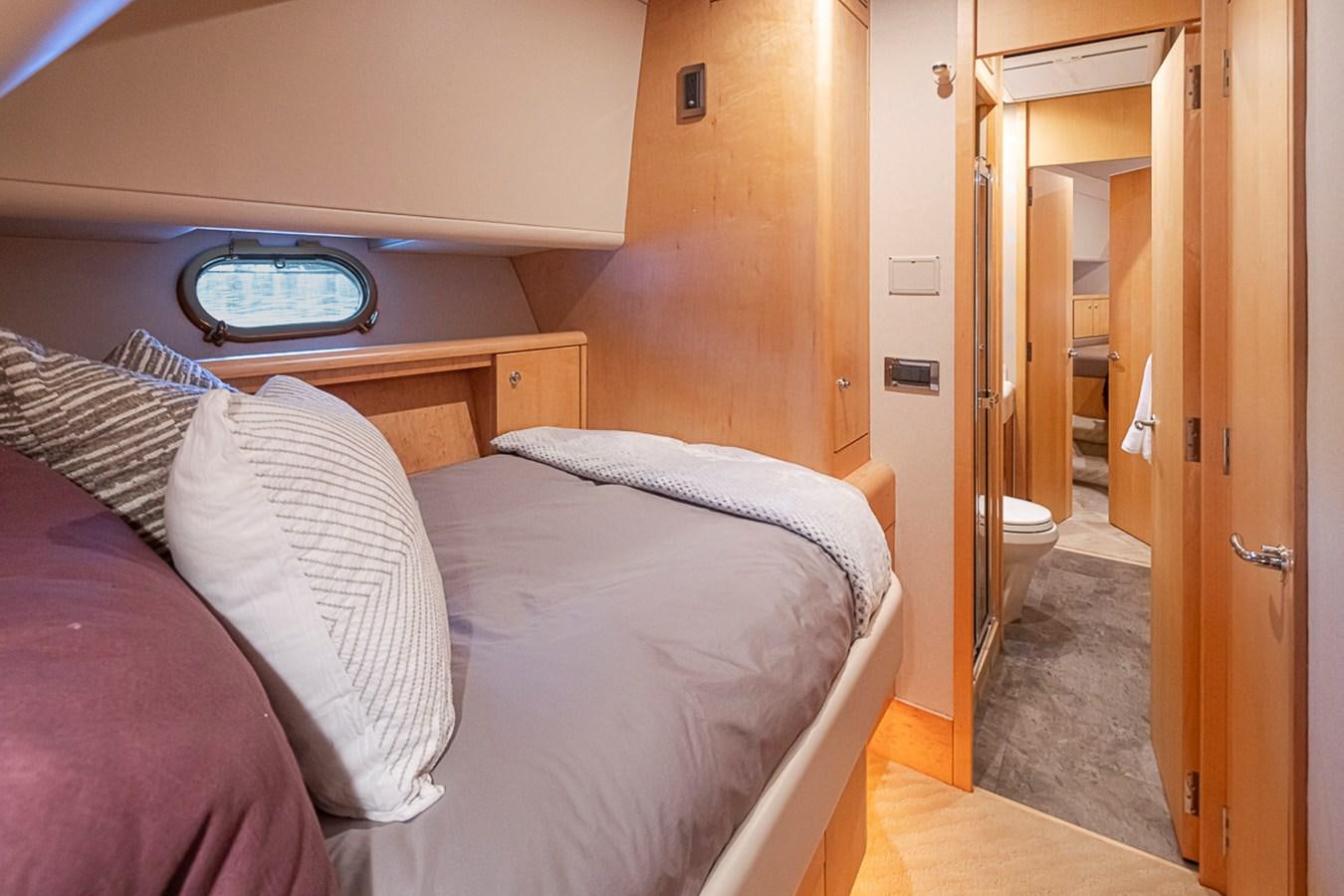 a bed in a room aboard SEA SPUR Yacht for Sale