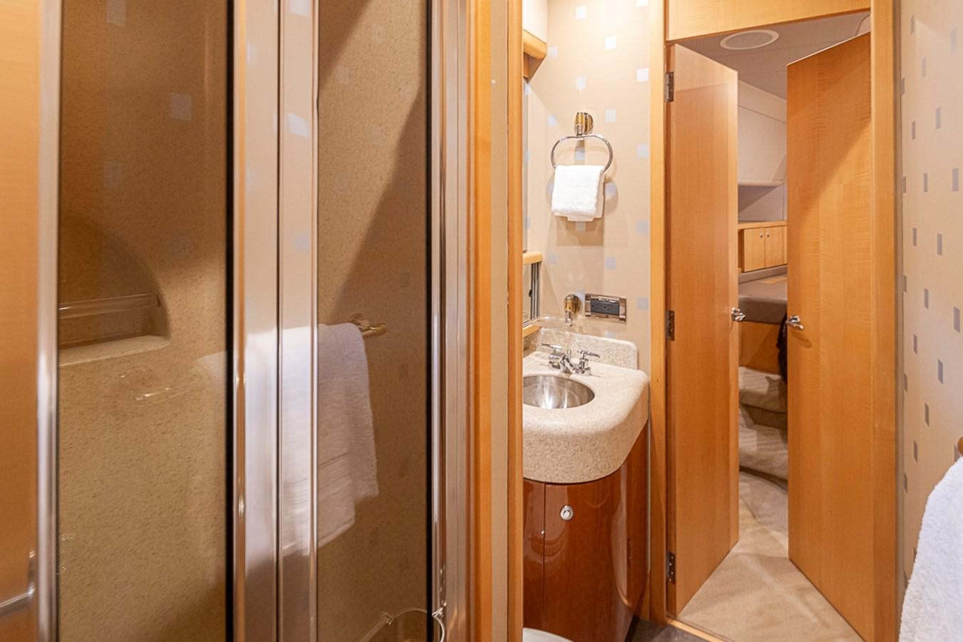 a bathroom with a sink and a mirror aboard SEA SPUR Yacht for Sale