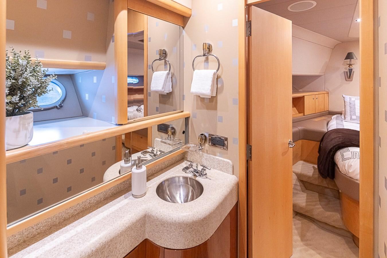 a bathroom with a sink and a mirror aboard SEA SPUR Yacht for Sale