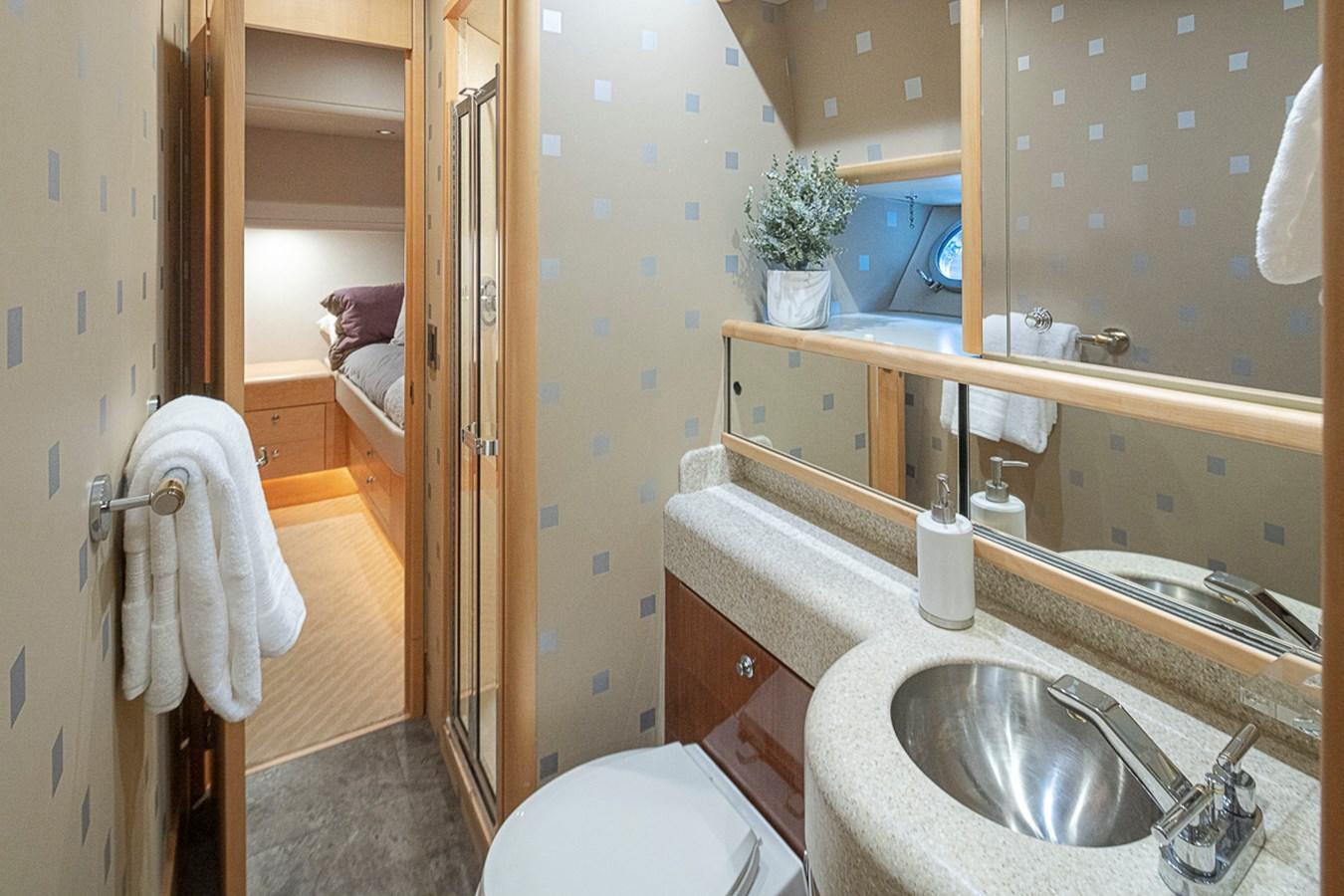 a bathroom with a sink and toilet aboard SEA SPUR Yacht for Sale