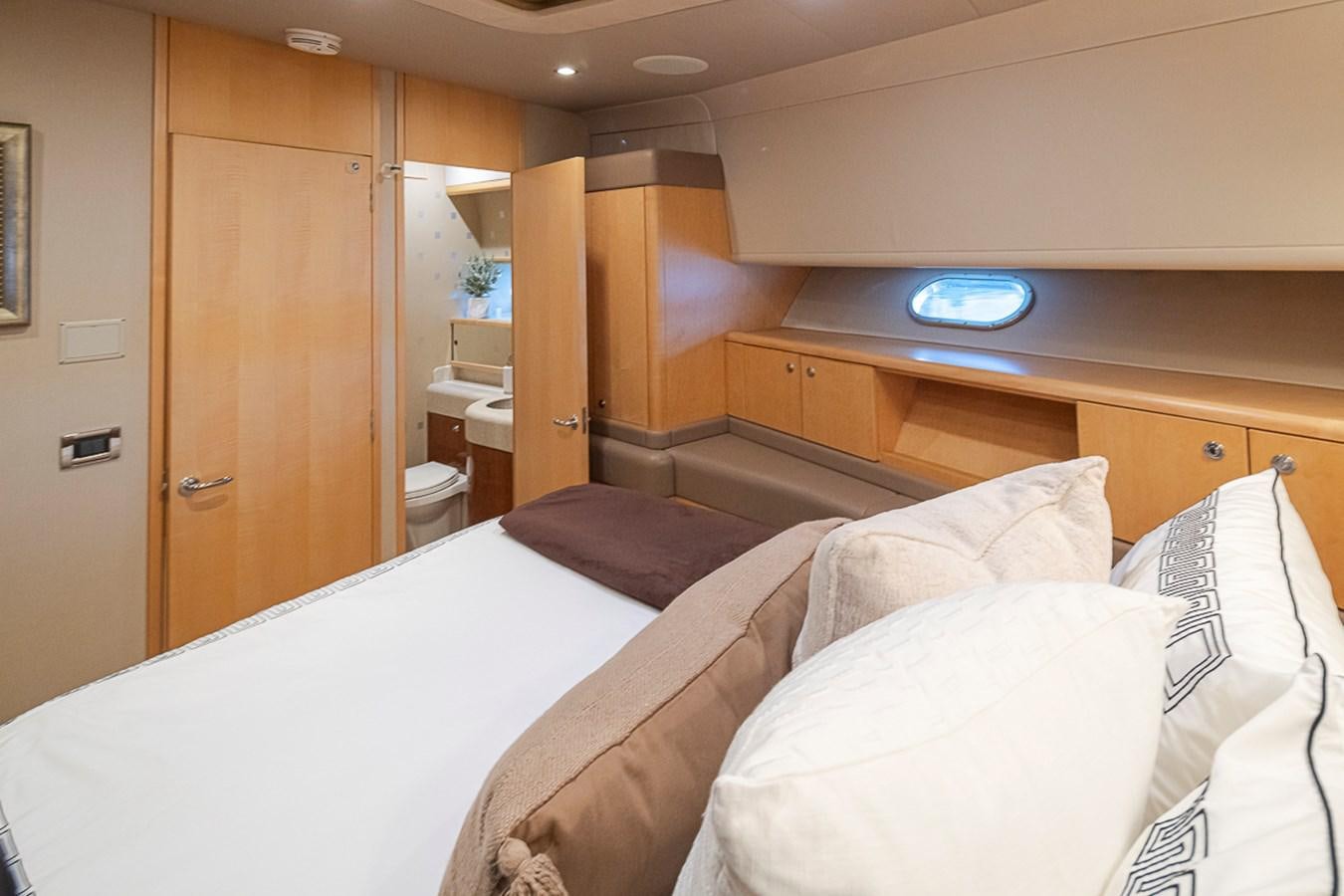 a room with a bed and a closet aboard SEA SPUR Yacht for Sale