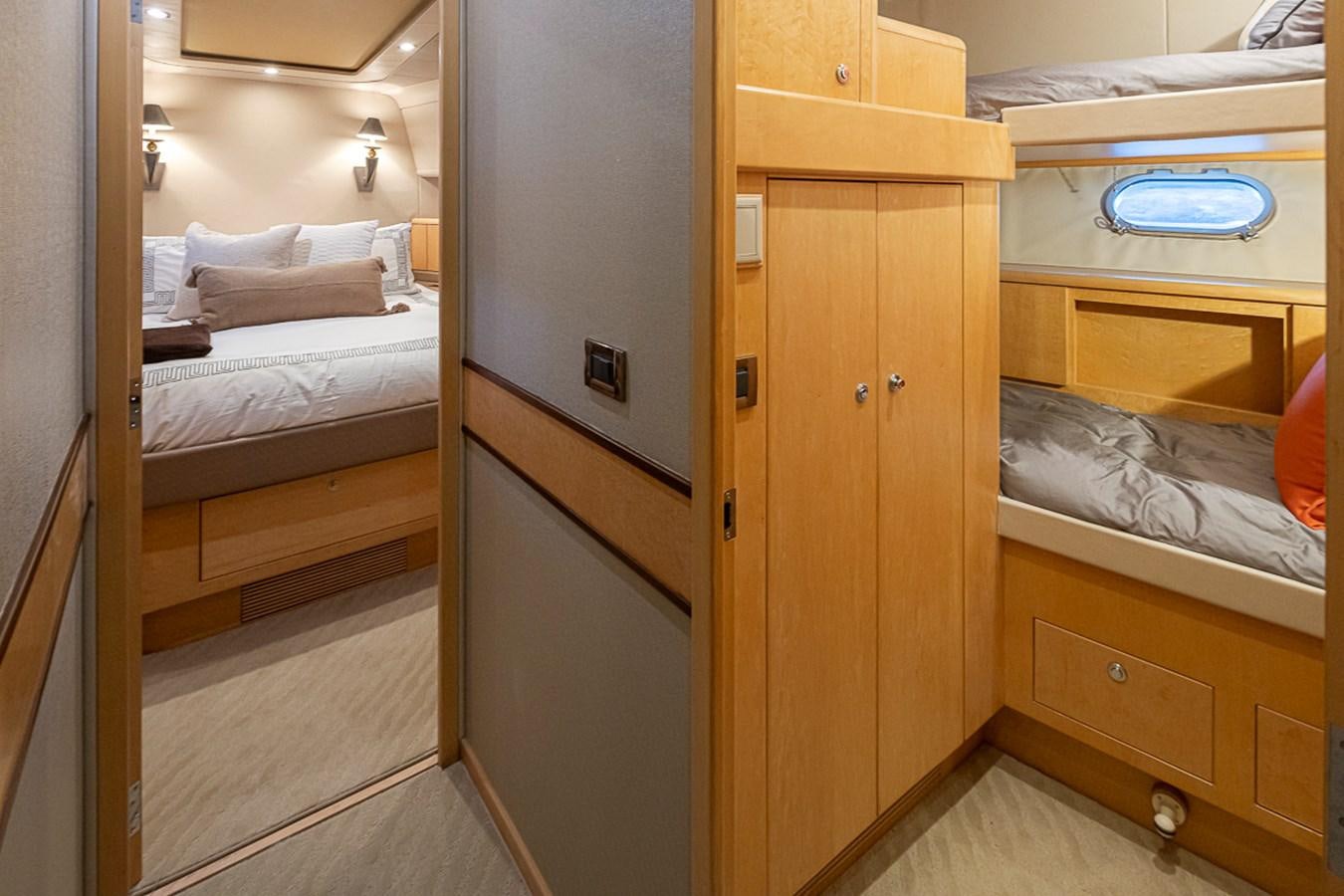a room with a bed and a desk aboard SEA SPUR Yacht for Sale
